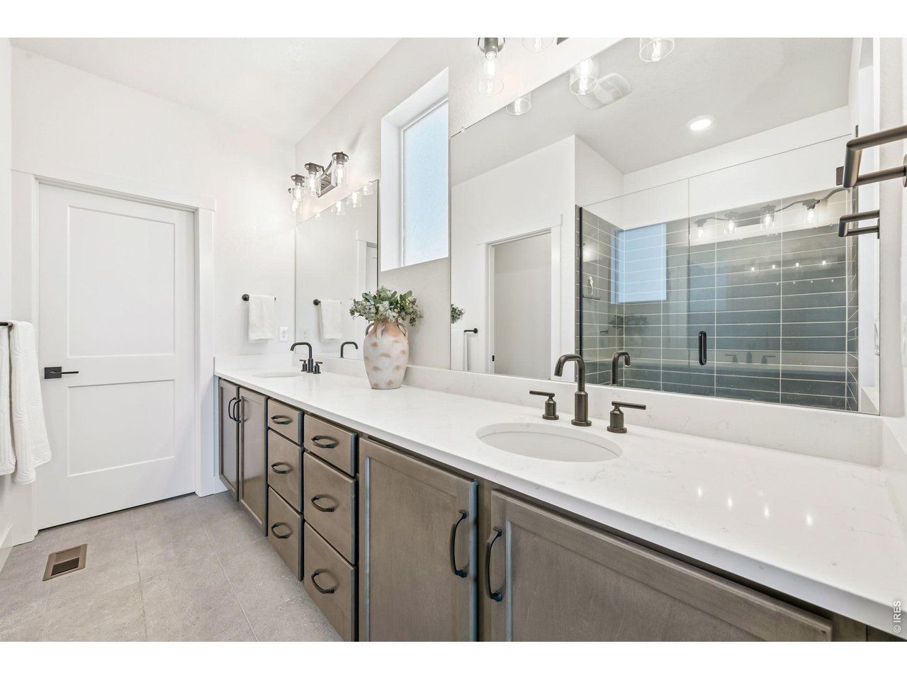 761 Muturu Road Johnstown, CO 80534 - Photo 12 of 35 Private en suite includes plenty of storage space, a modern tile shower, and a large walk-in closet.