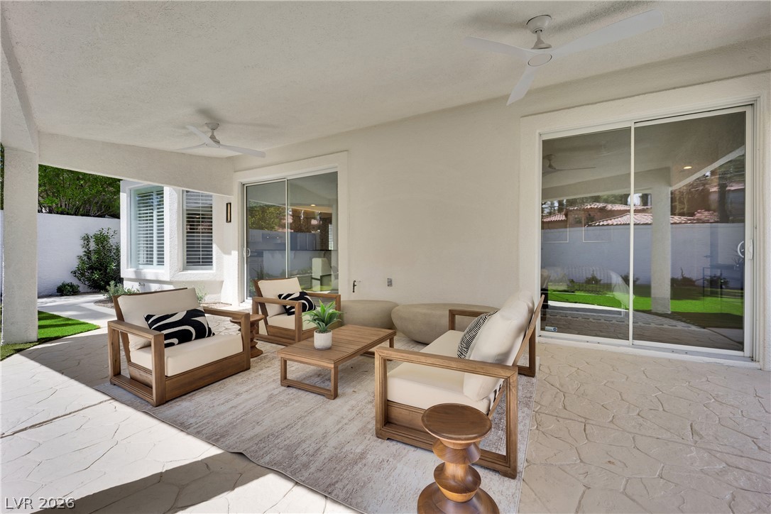 8981 Rivers Edge Drive Las Vegas, NV 89117 - Photo 52 of 69 An inviting covered patio offers a comfortable outdoor living space for relaxation and entertaining.