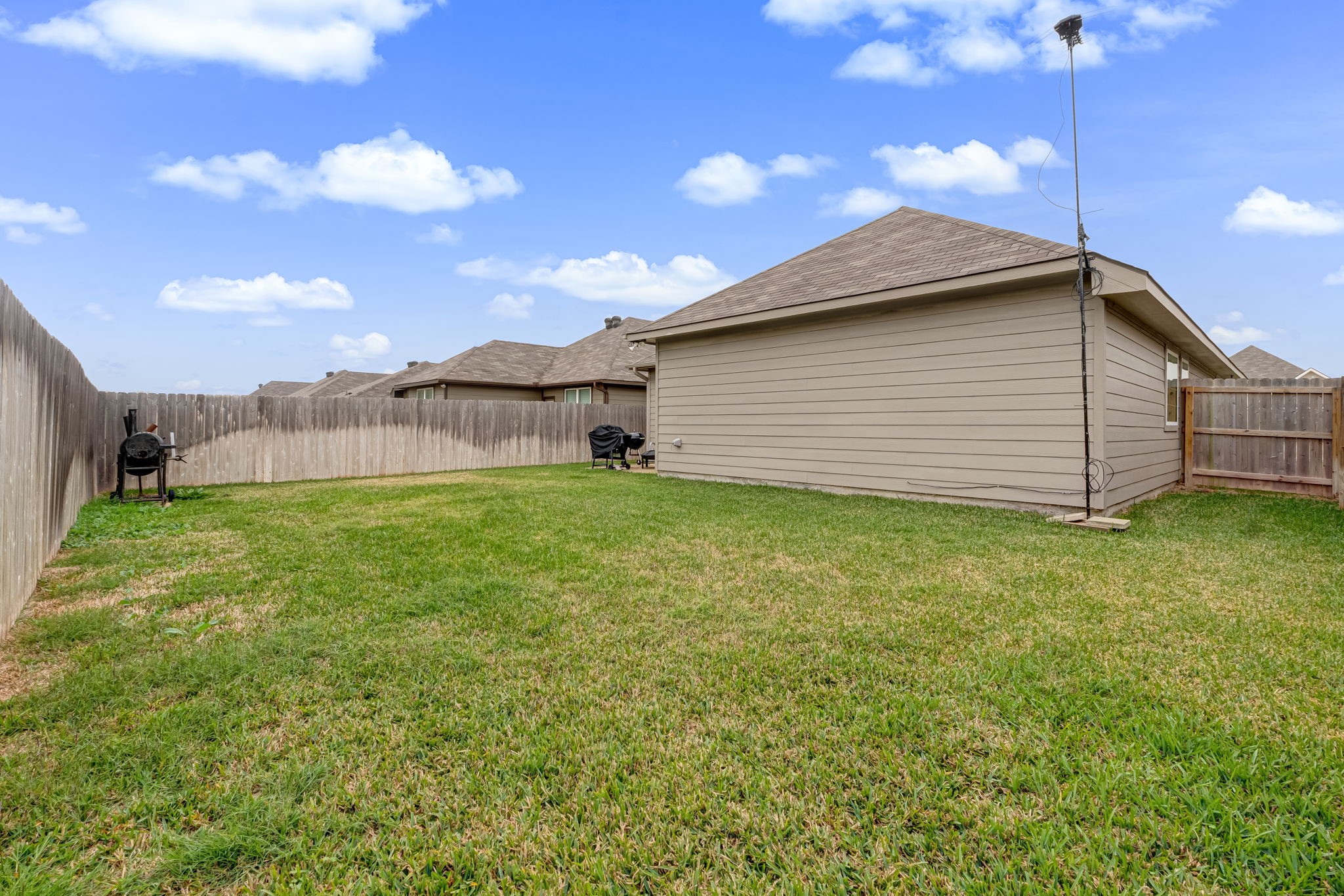 1946 Chief Street Bryan, TX 77807 - Photo 29 of 30 a backyard of a house with lots of green space