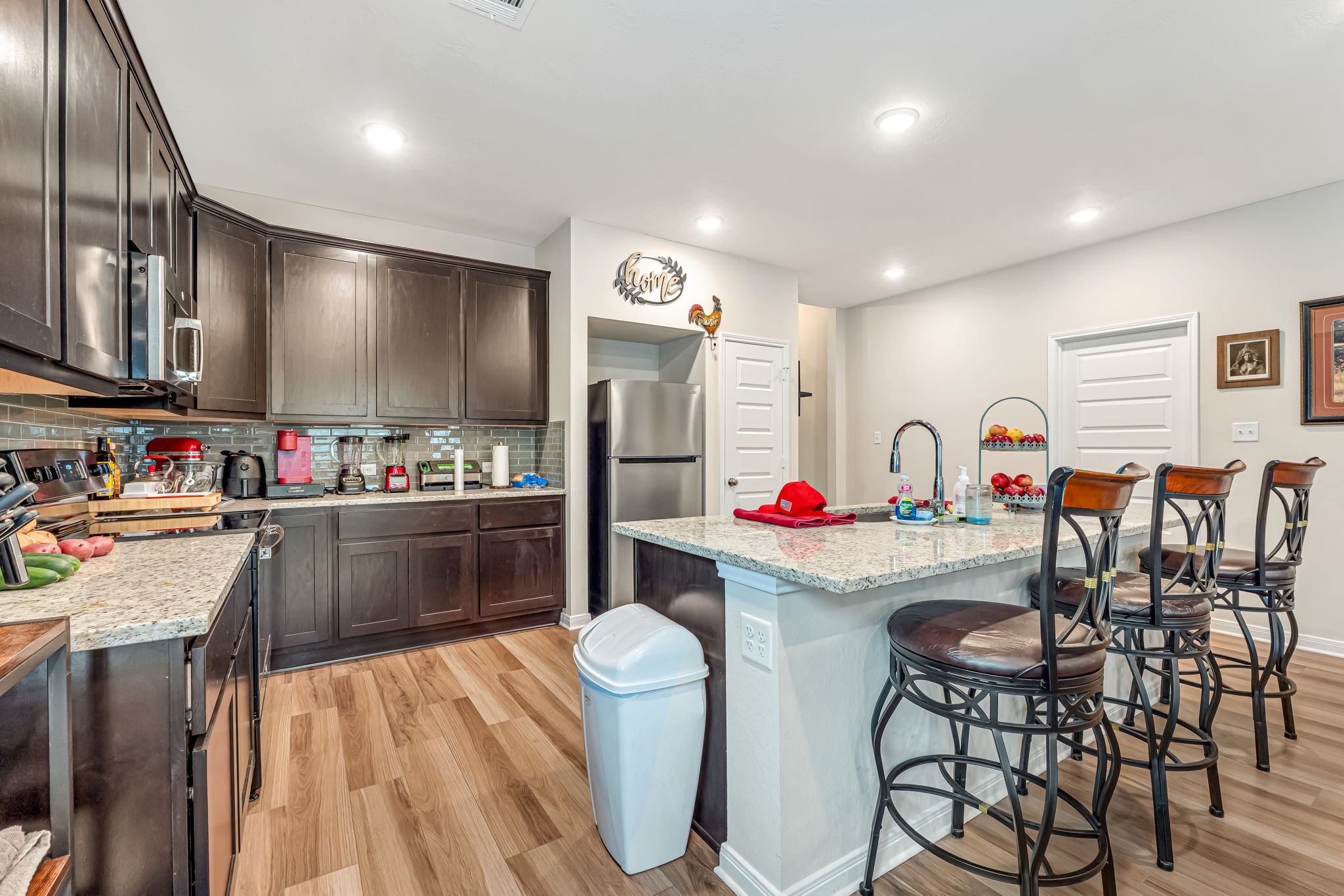 1946 Chief Street Bryan, TX 77807 - Photo 7 of 30 a kitchen that has cabinets a sink and appliances