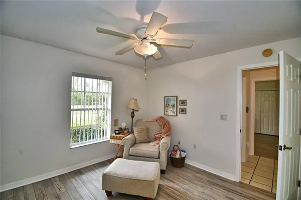 a very nice looking room with a large window with the view of the porch