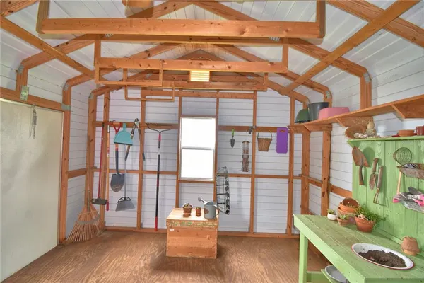 a view of a big yard with a large trees