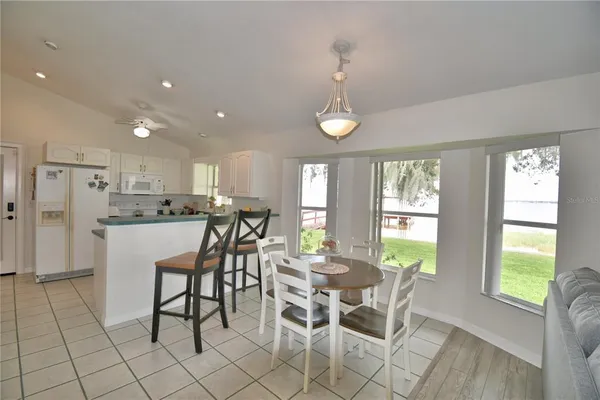 a living room with furniture a fireplace and a window