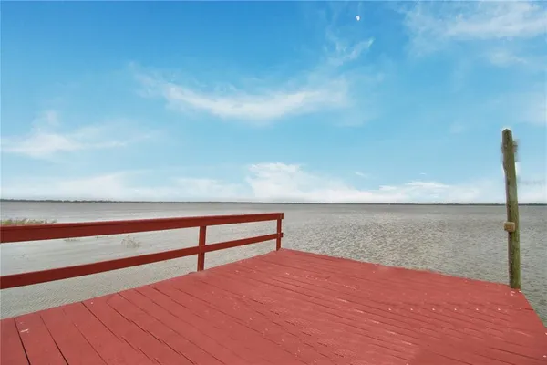 a view of a house with a yard and pathway