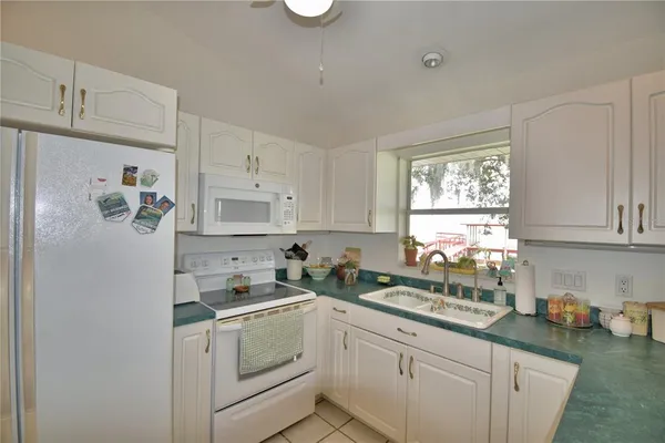 a view of a dining room with furniture and window