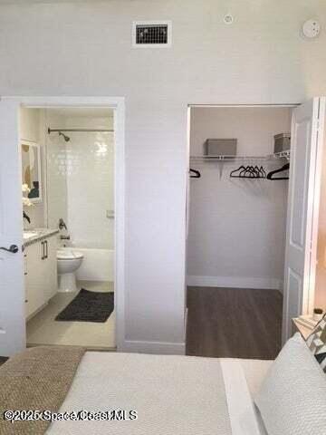 2760 Bosque Circle, Unit 307 Melbourne, FL 32940 - Photo 11 of 18 a bathroom with a sink and a mirror