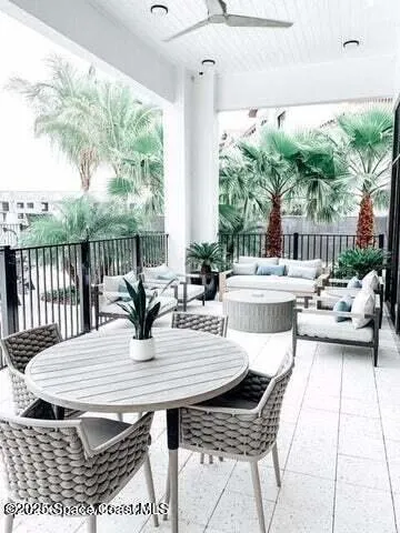 a view of a dining table and chairs in the patio
