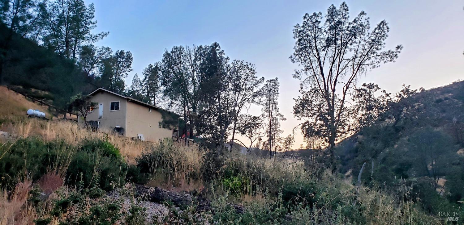 2163 Stagecoach Canyon Road Pope Valley, CA 94567 - Photo 17 of 22 a view of a house with a yard