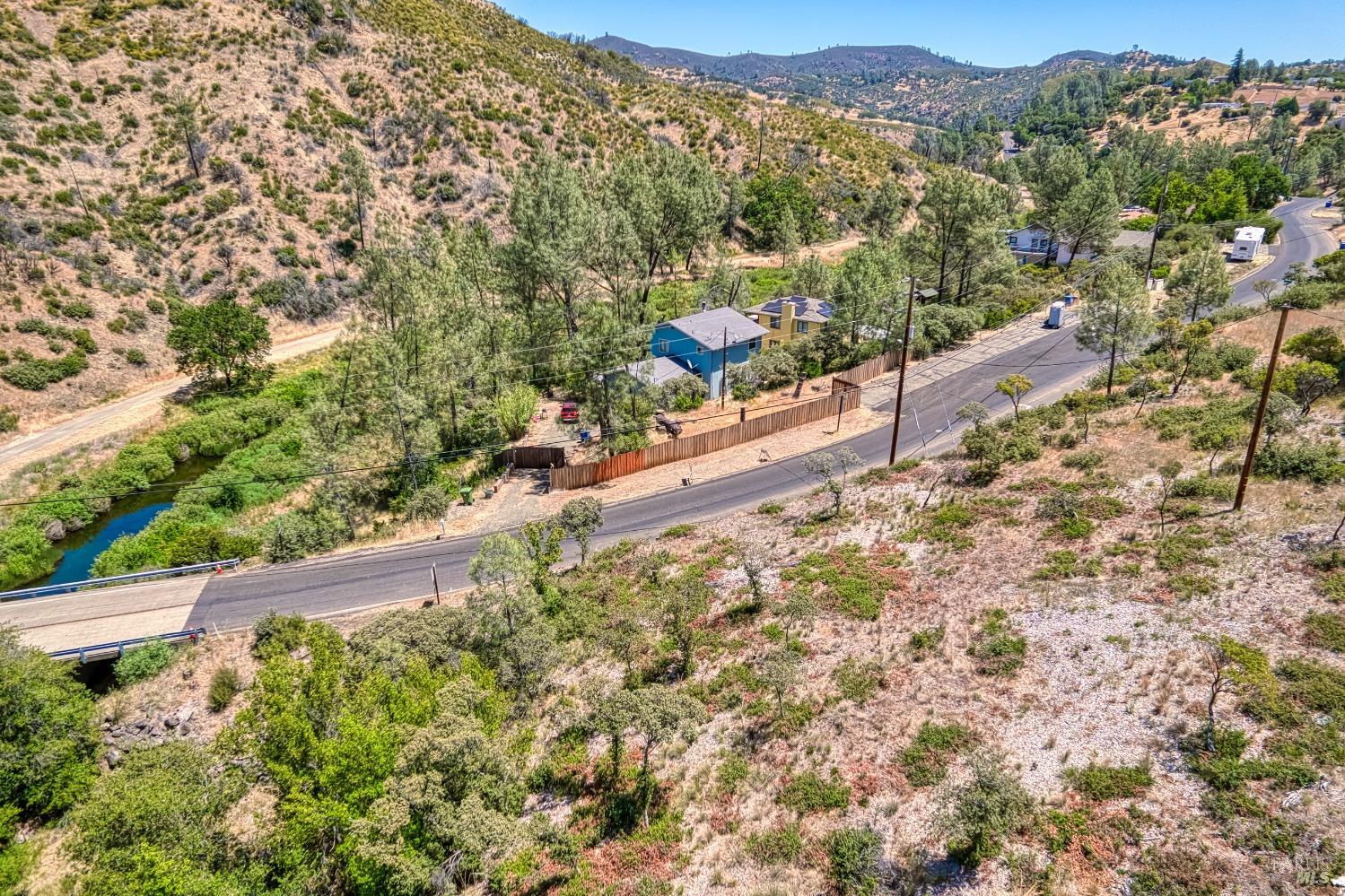 2163 Stagecoach Canyon Road Pope Valley, CA 94567 - Photo 4 of 22 a view of a city with lush green forest