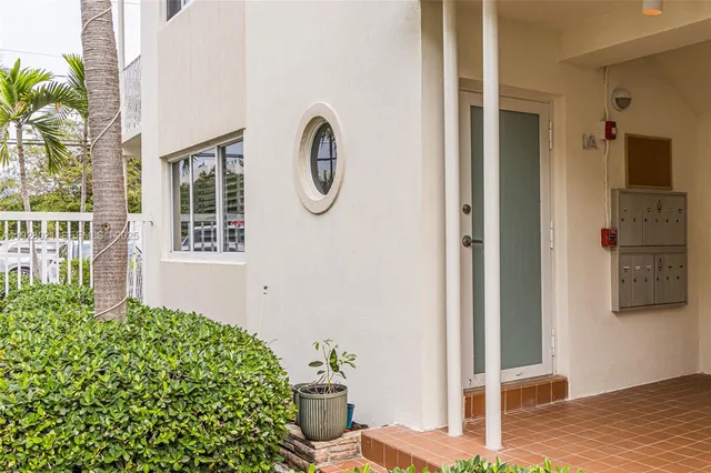 a front view of a house with outdoor seating