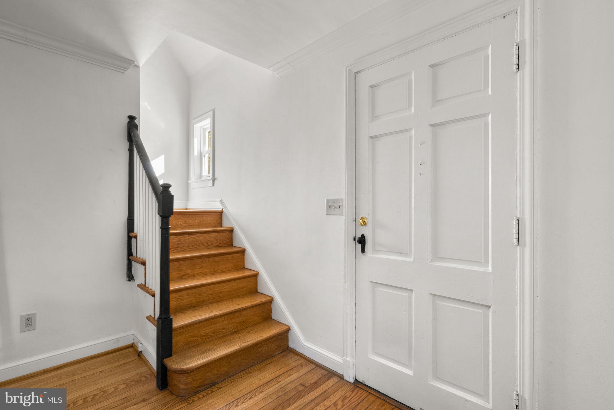 8702 Reading Road Silver Spring, MD 20901 - Photo 18 of 42 a view of entryway with wooden floor