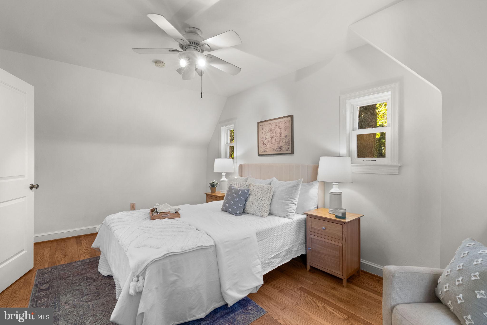 8702 Reading Road Silver Spring, MD 20901 - Photo 20 of 42 a bedroom with bed and a chandelier