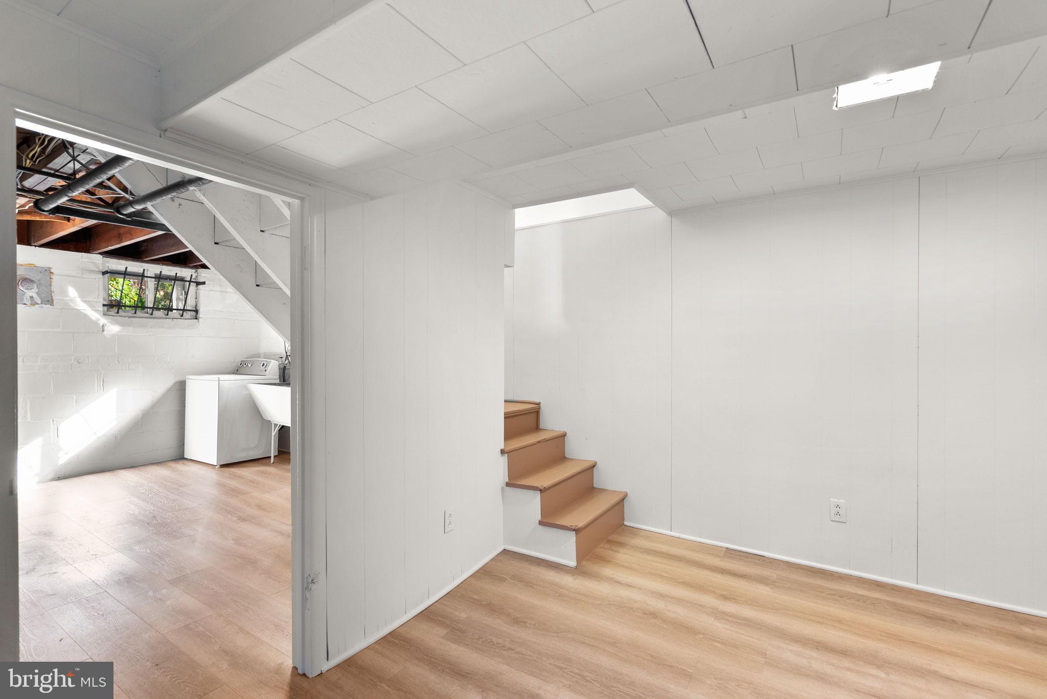 8702 Reading Road Silver Spring, MD 20901 - Photo 28 of 42 a view of an empty room and wooden floor