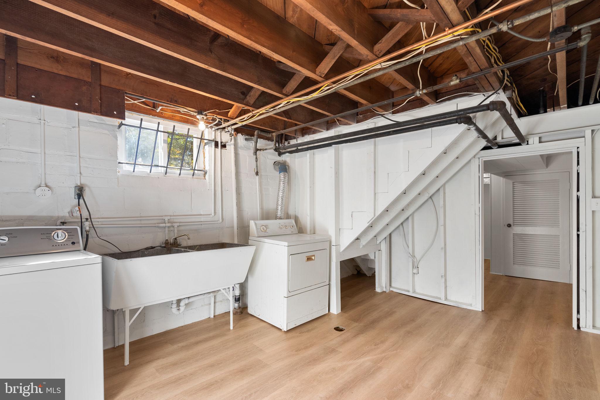 8702 Reading Road Silver Spring, MD 20901 - Photo 34 of 42 a utility room with cabinets