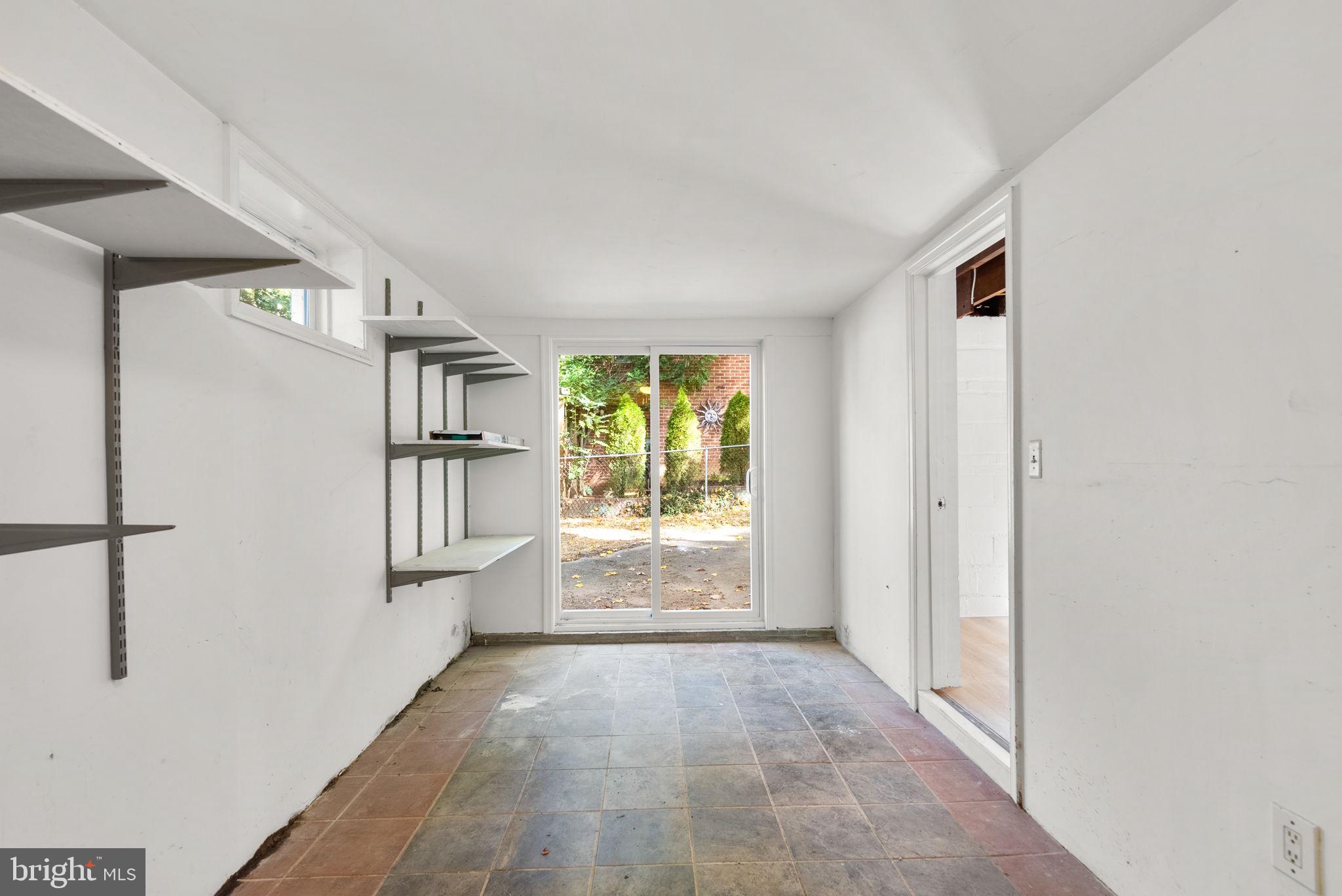 8702 Reading Road Silver Spring, MD 20901 - Photo 37 of 42 a view of an empty room with a window