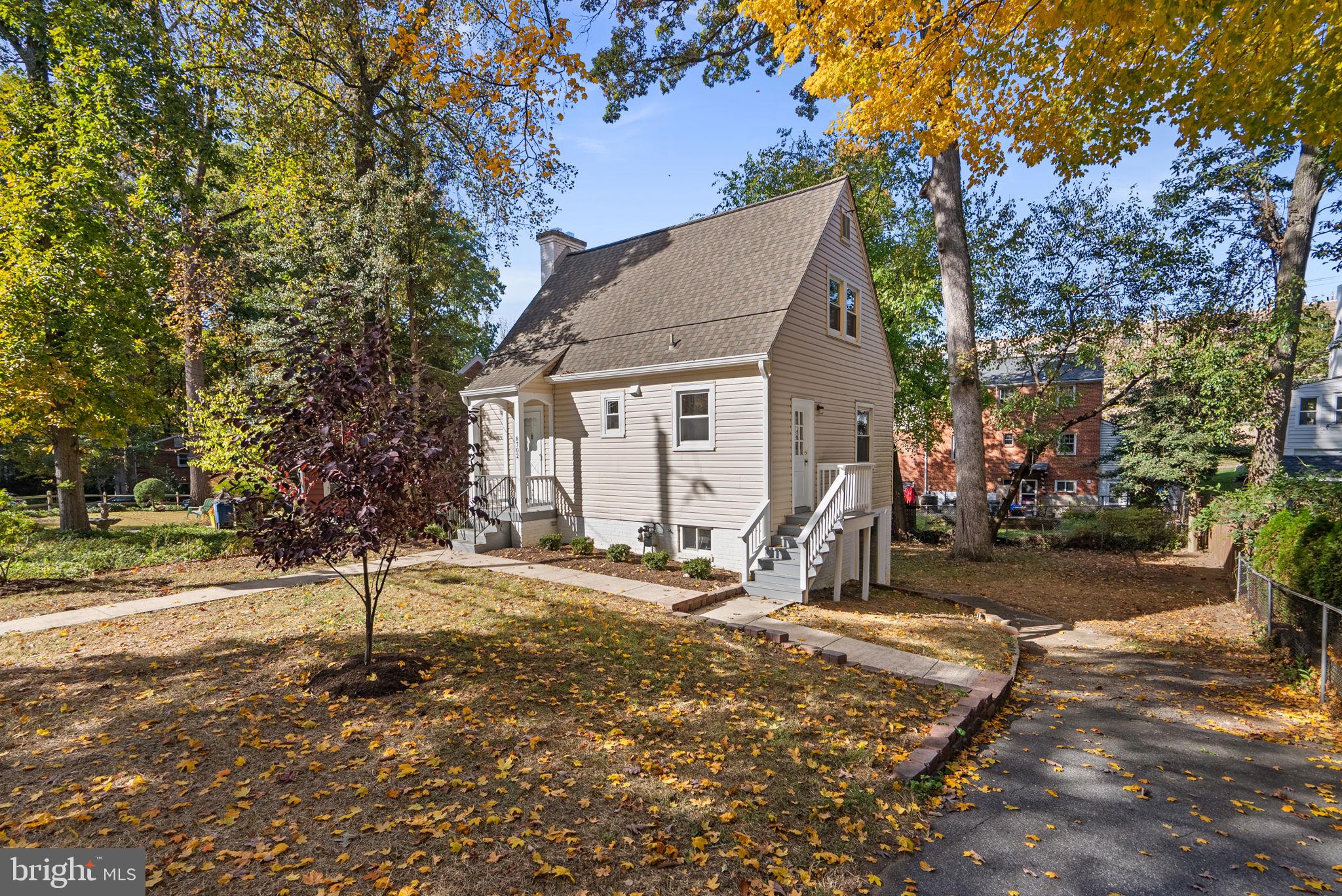8702 Reading Road Silver Spring, MD 20901 - Photo 4 of 42 a view of a house with backyard