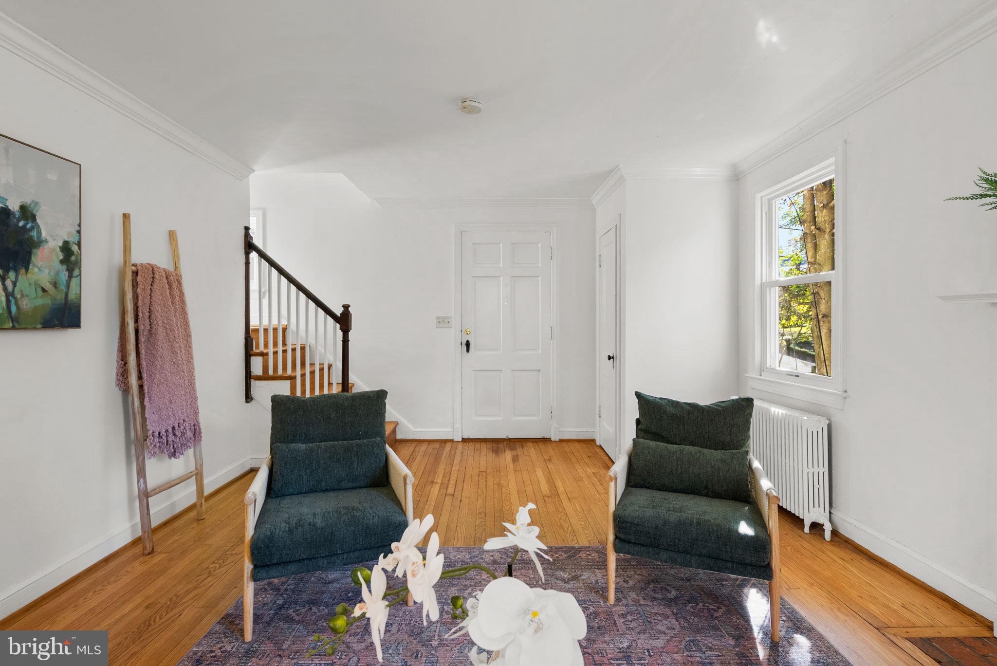 8702 Reading Road Silver Spring, MD 20901 - Photo 9 of 42 a living room with furniture and wooden floor