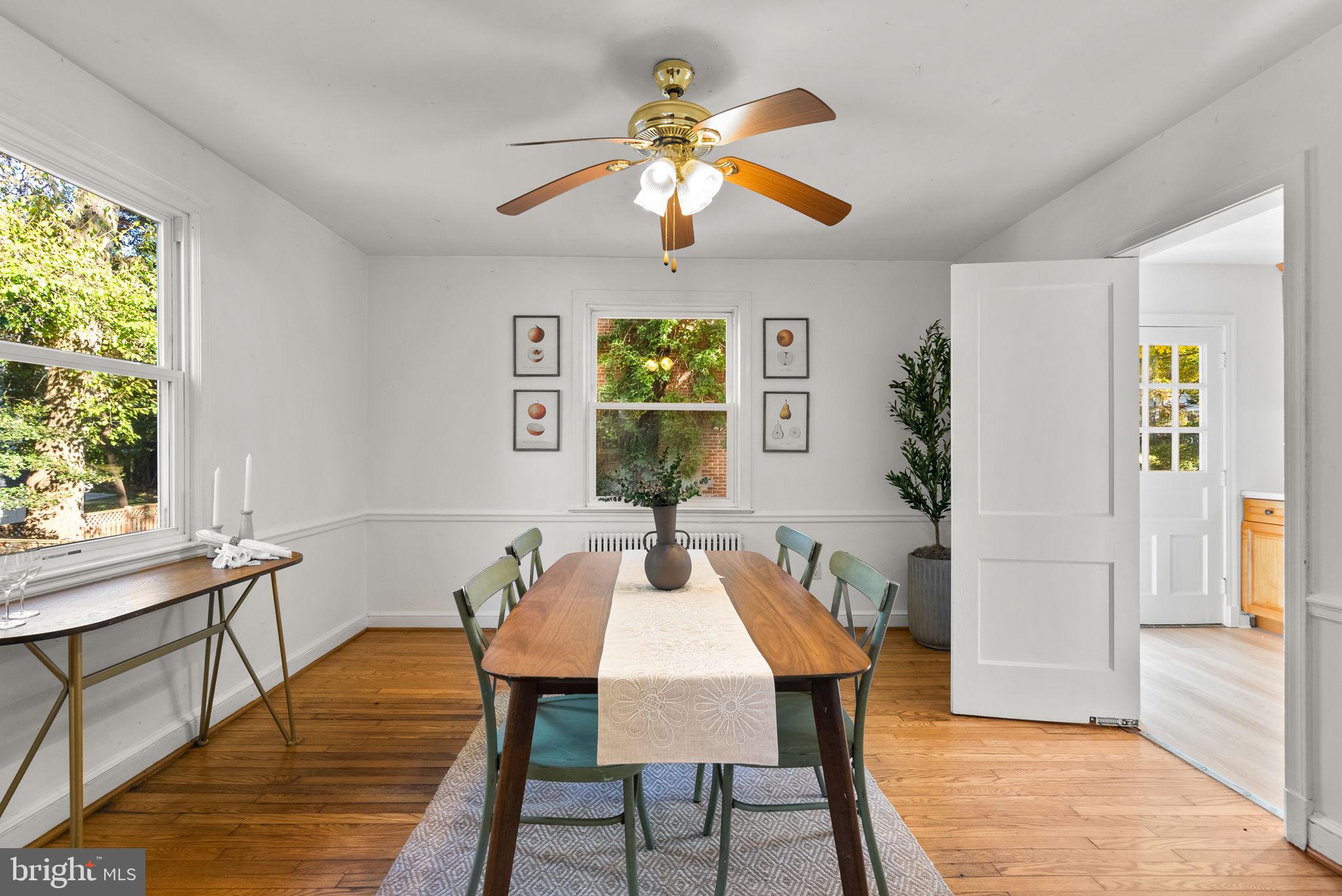 8702 Reading Road Silver Spring, MD 20901 - Photo 10 of 42 a view of a dining room with furniture window and wooden floor