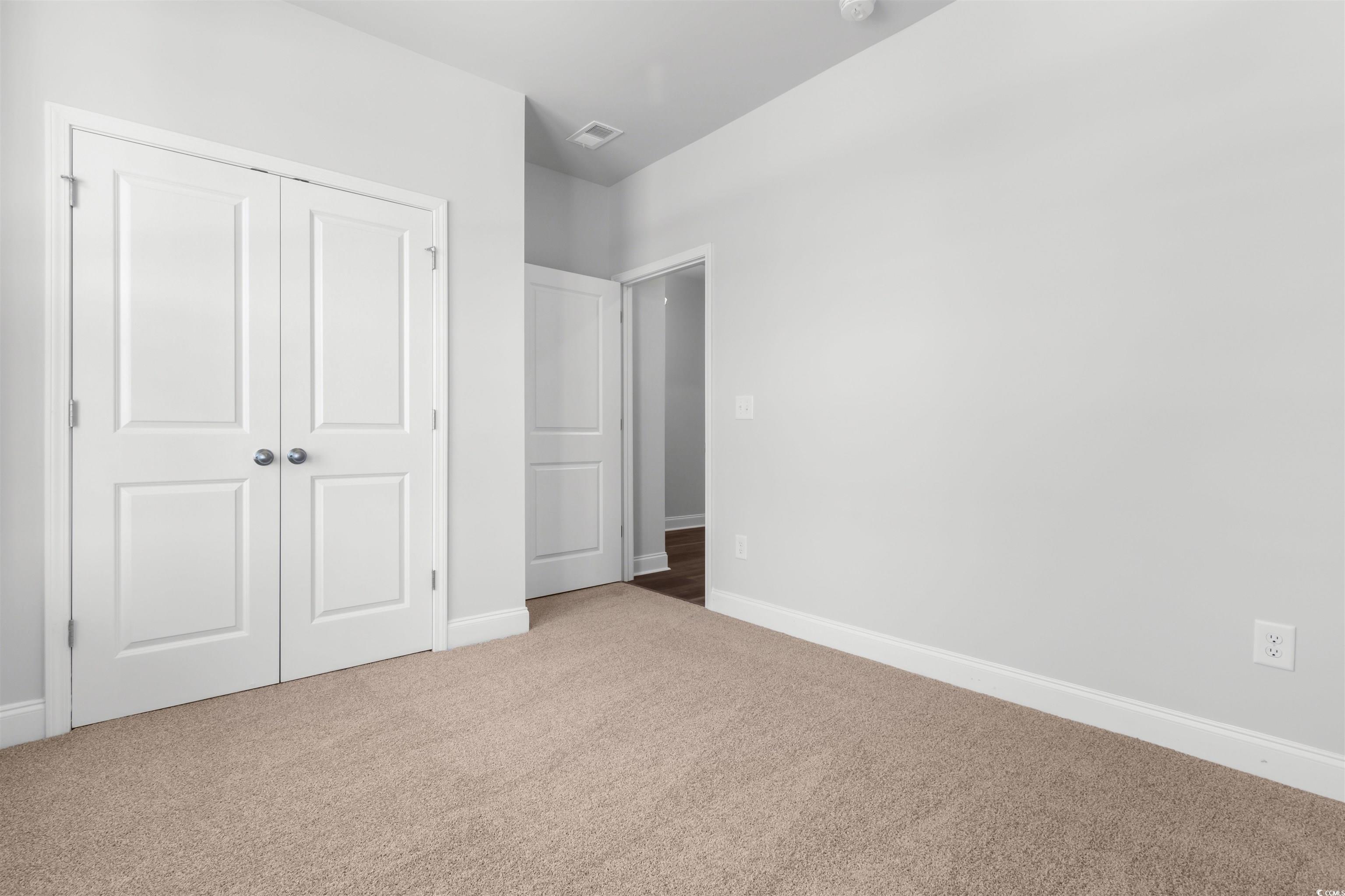 2427 Campton Loop Conway, SC 29527 - Photo 30 of 40 Unfurnished bedroom with a closet and carpet floor