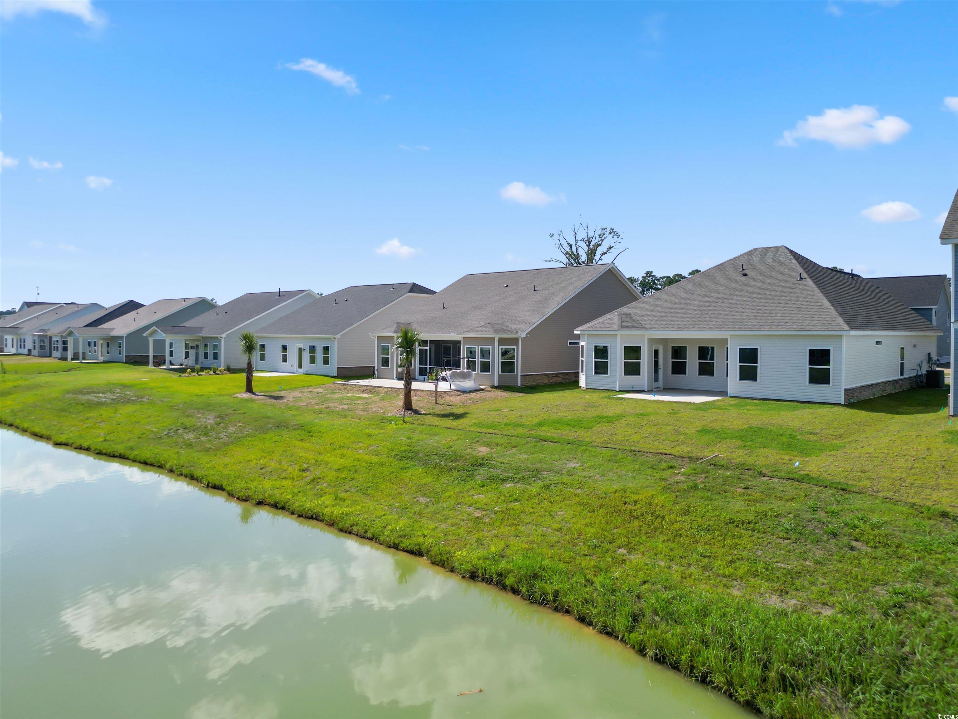 2427 Campton Loop Conway, SC 29527 - Photo 5 of 40 Rear view of property featuring a lawn and a water