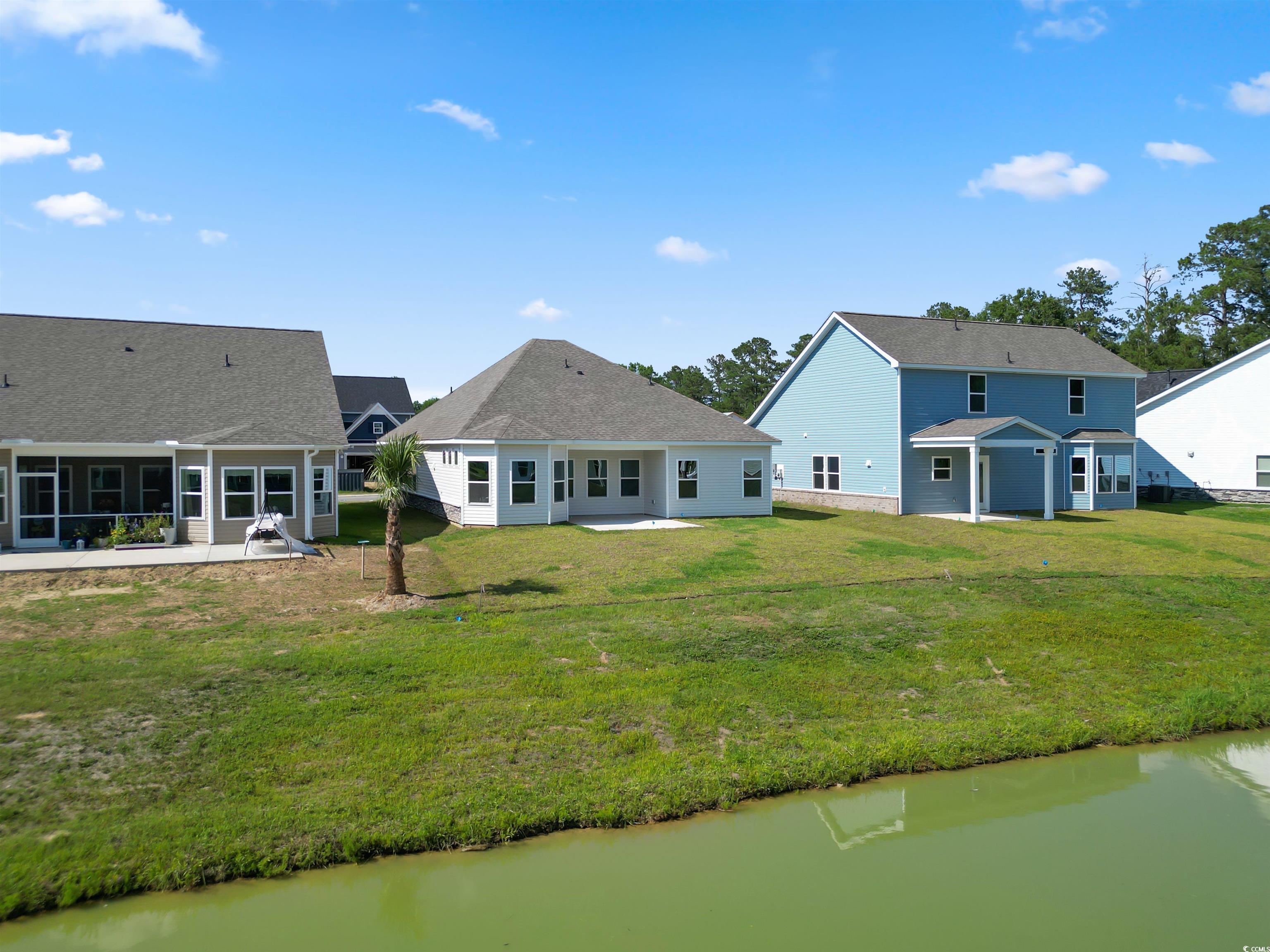 2427 Campton Loop Conway, SC 29527 - Photo 6 of 40 Rear view of house featuring a patio area, a lawn,
