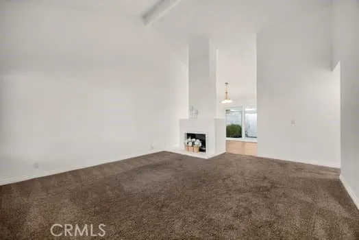 an empty room with fireplace