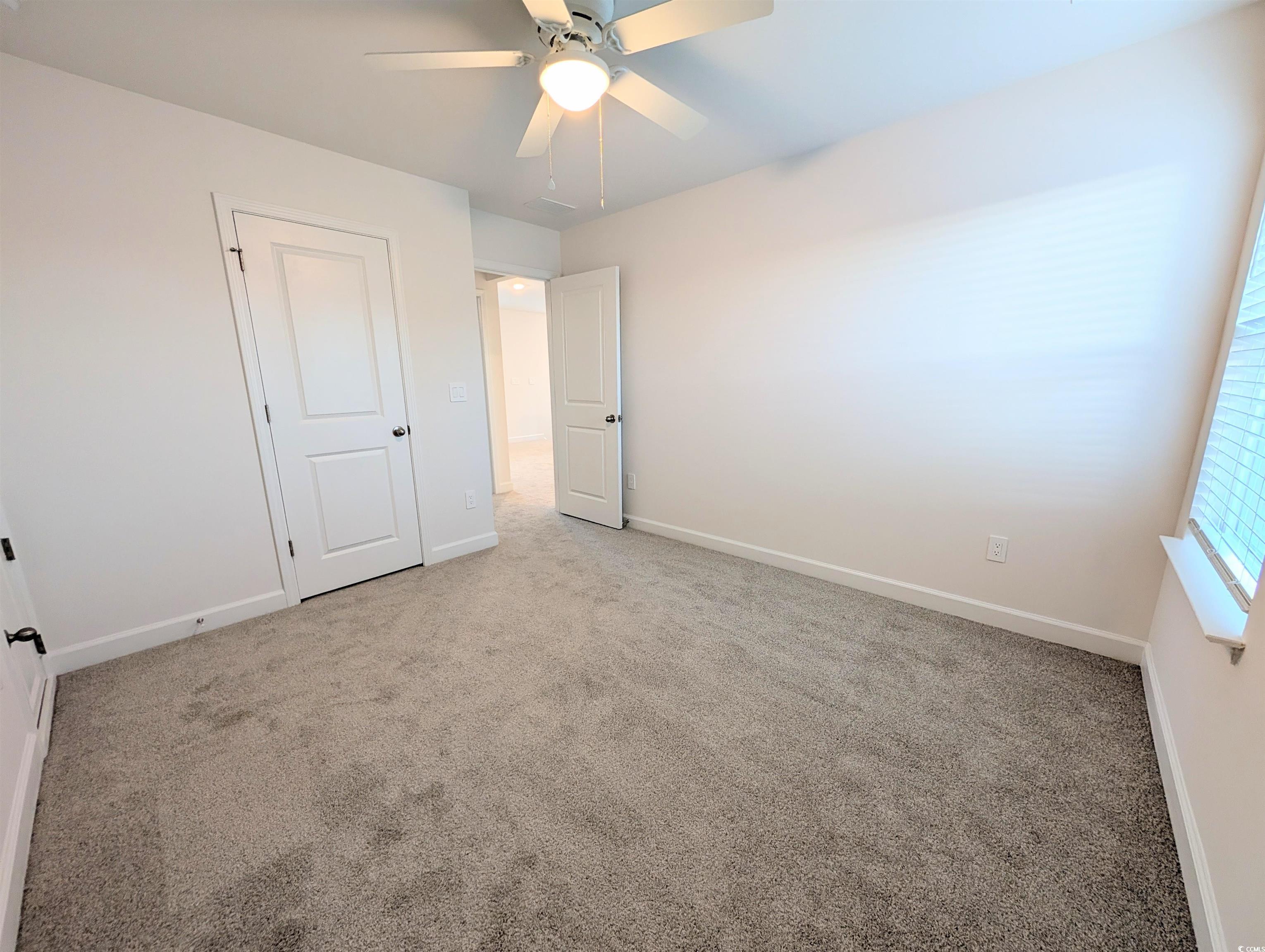 1109 Lauryn Oak Loop Longs, SC 29568 - Photo 28 of 40 Unfurnished bedroom with carpet flooring and ceiling fan