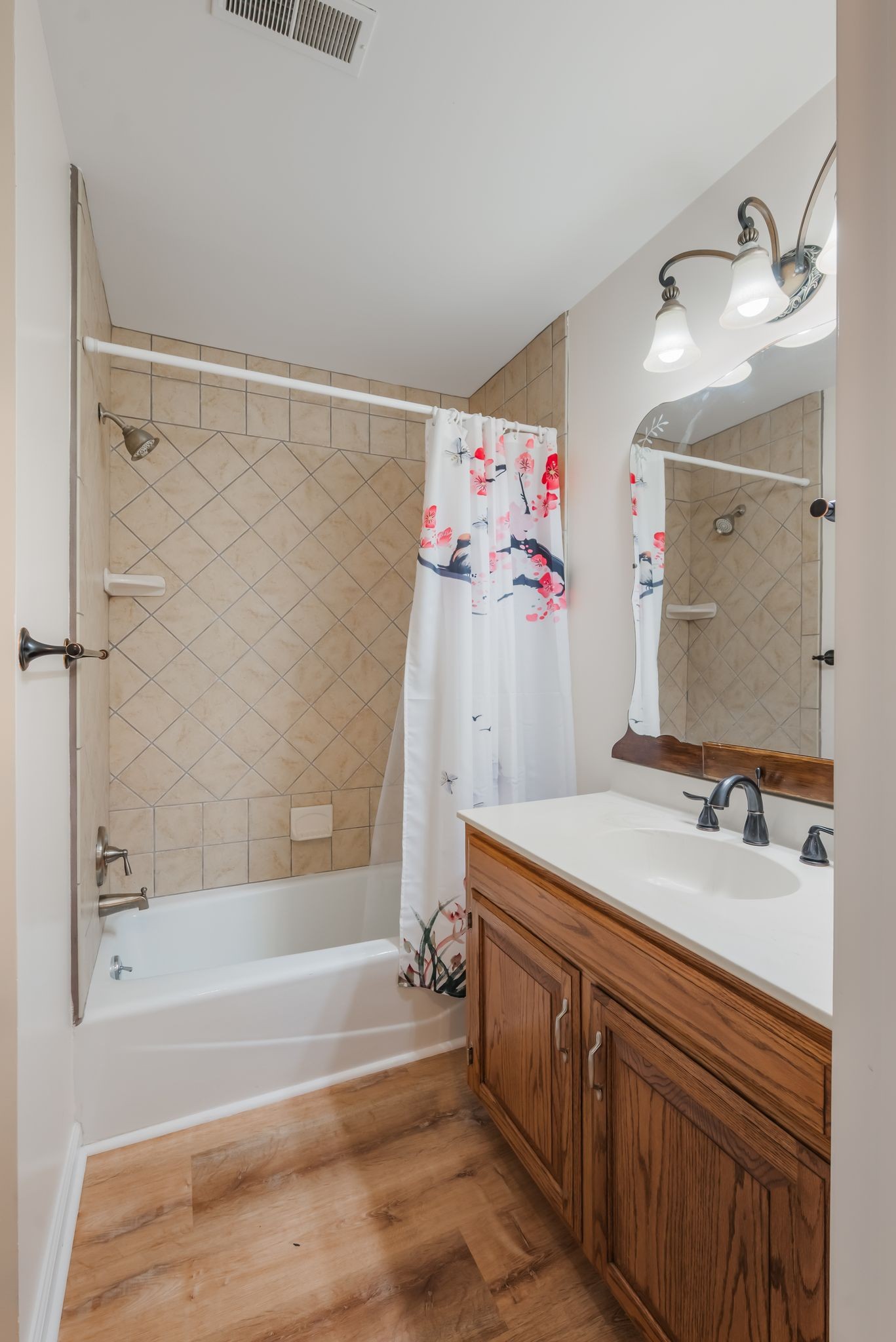 1281 General George Patton Road Nashville, TN 37221 - Photo 22 of 32 a bathroom with a sink vanity tub and a mirror