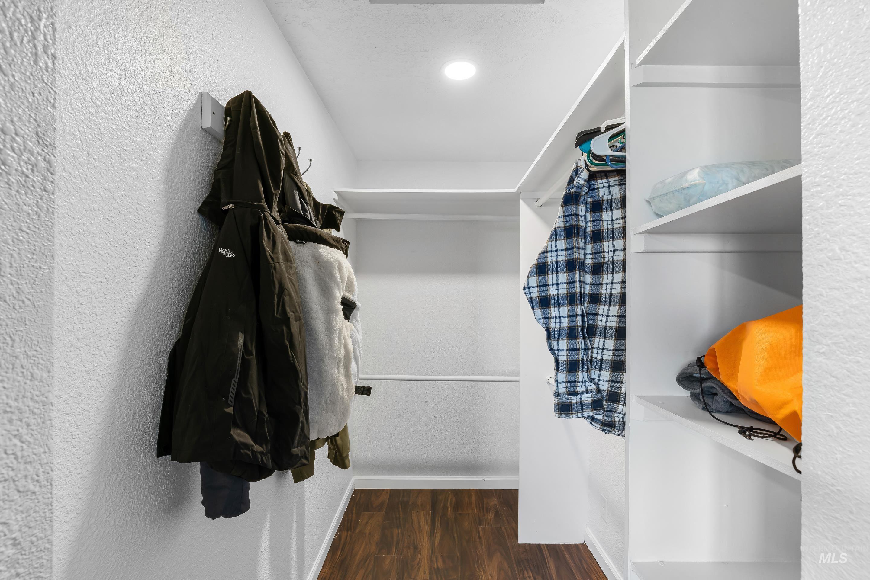10294 West Fox Ridge Drive Boise, ID 83709 - Photo 19 of 50 Walk in closet with dark wood finished floors