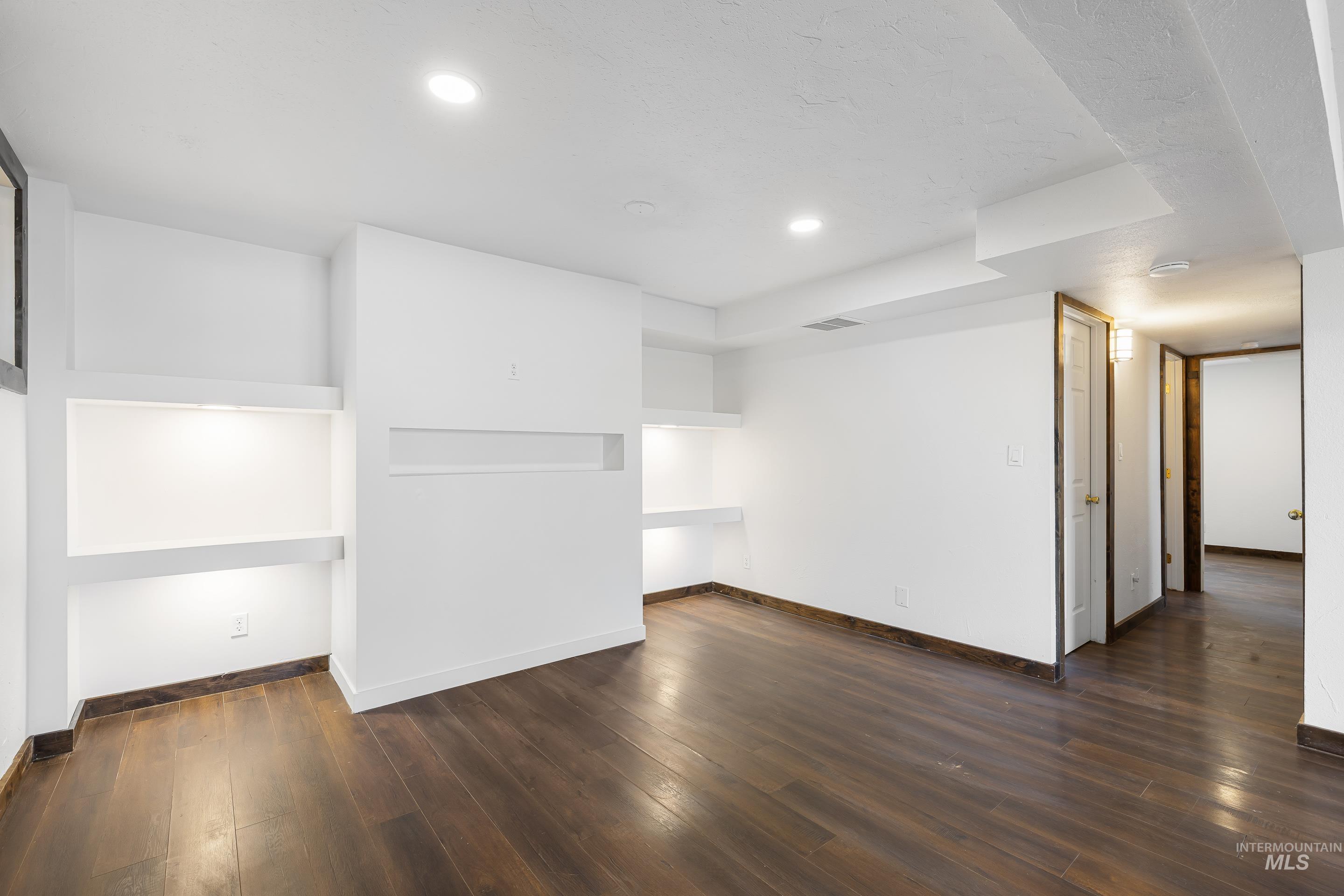 10294 West Fox Ridge Drive Boise, ID 83709 - Photo 26 of 50 Finished basement featuring dark wood finished floors and recessed lighting