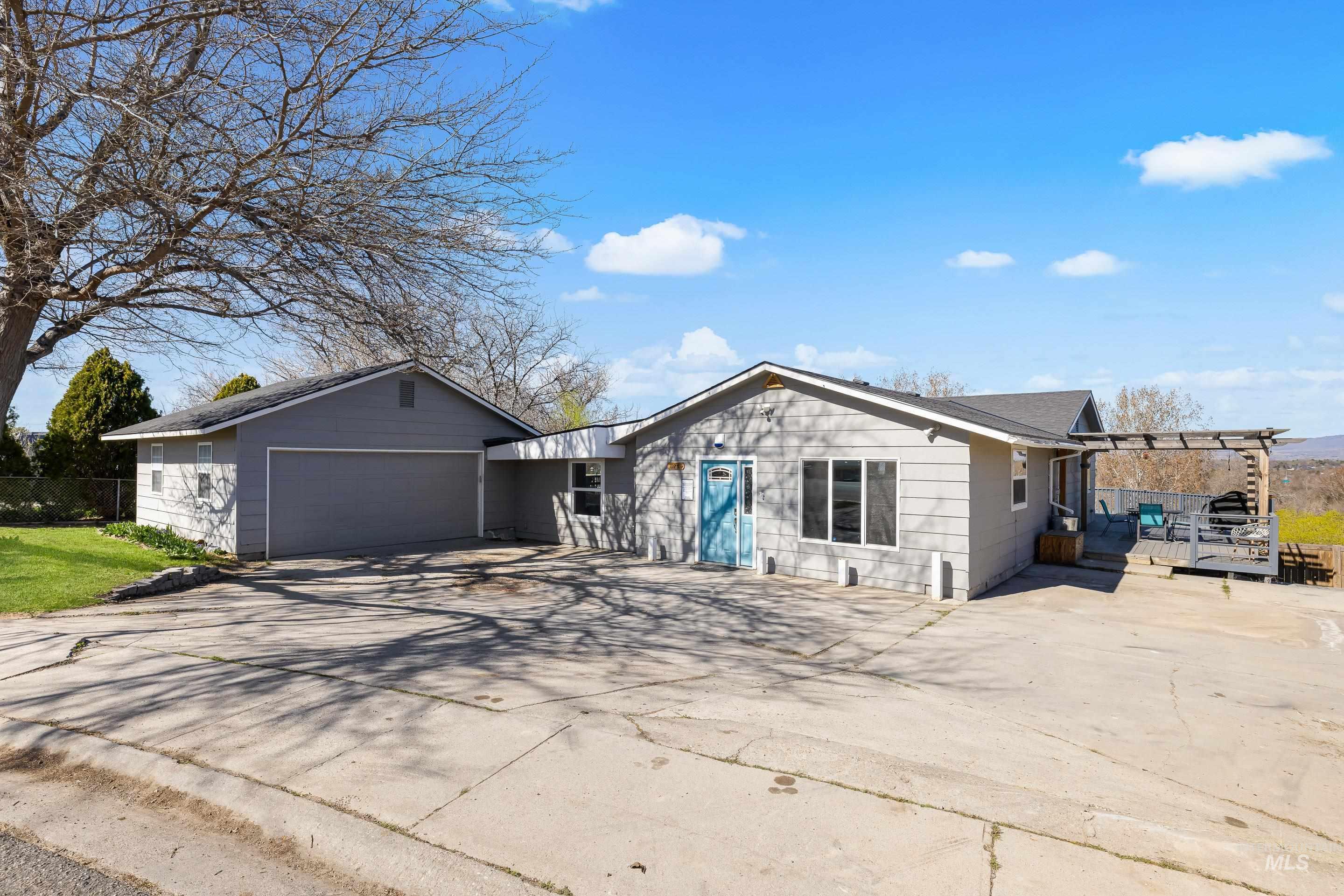 10294 West Fox Ridge Drive Boise, ID 83709 - Photo 3 of 50 Ranch-style house with driveway, a garage, and a pergola