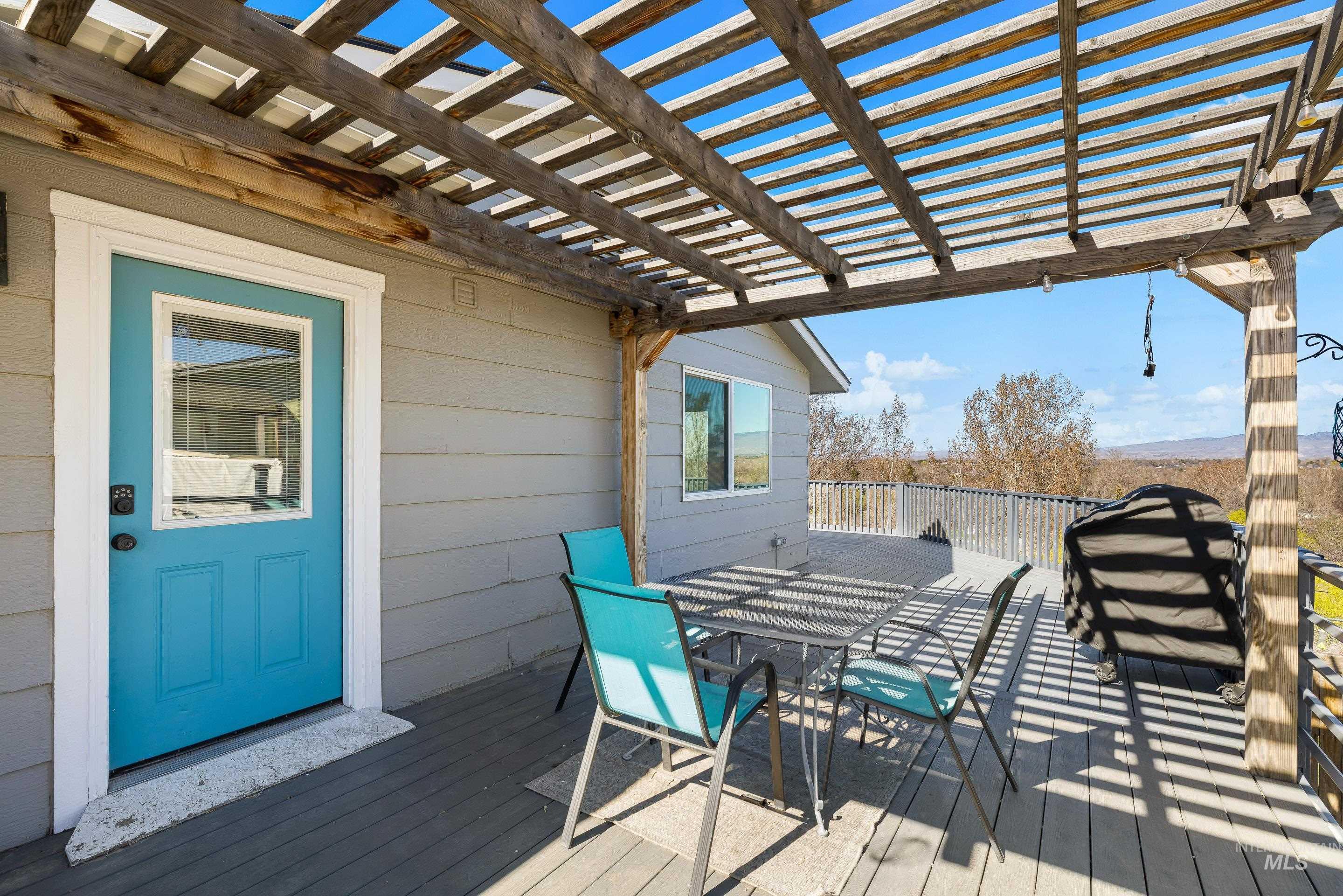 10294 West Fox Ridge Drive Boise, ID 83709 - Photo 45 of 50 Deck with outdoor dining space and a pergola