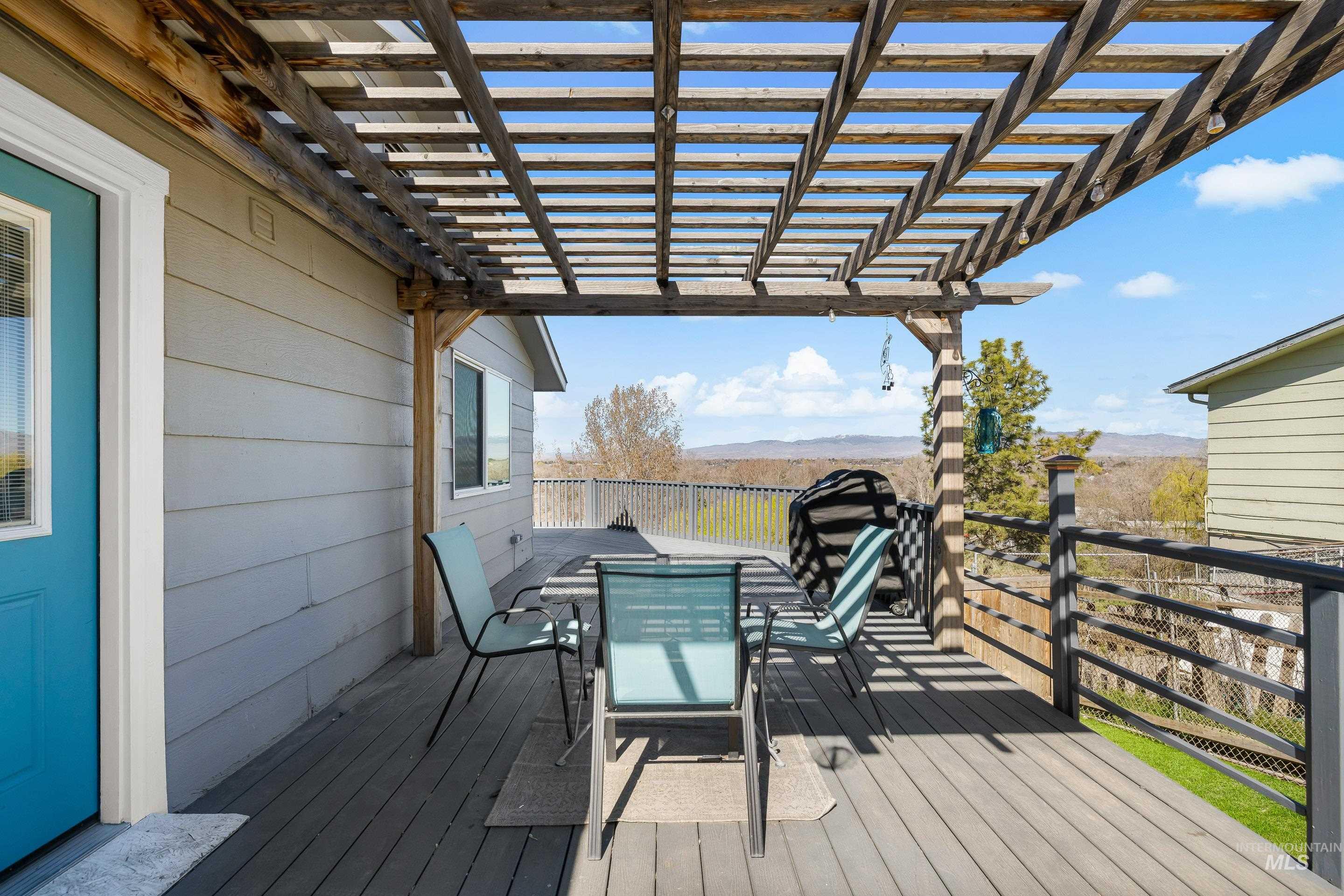 10294 West Fox Ridge Drive Boise, ID 83709 - Photo 46 of 50 Deck featuring outdoor dining space and a mountain view