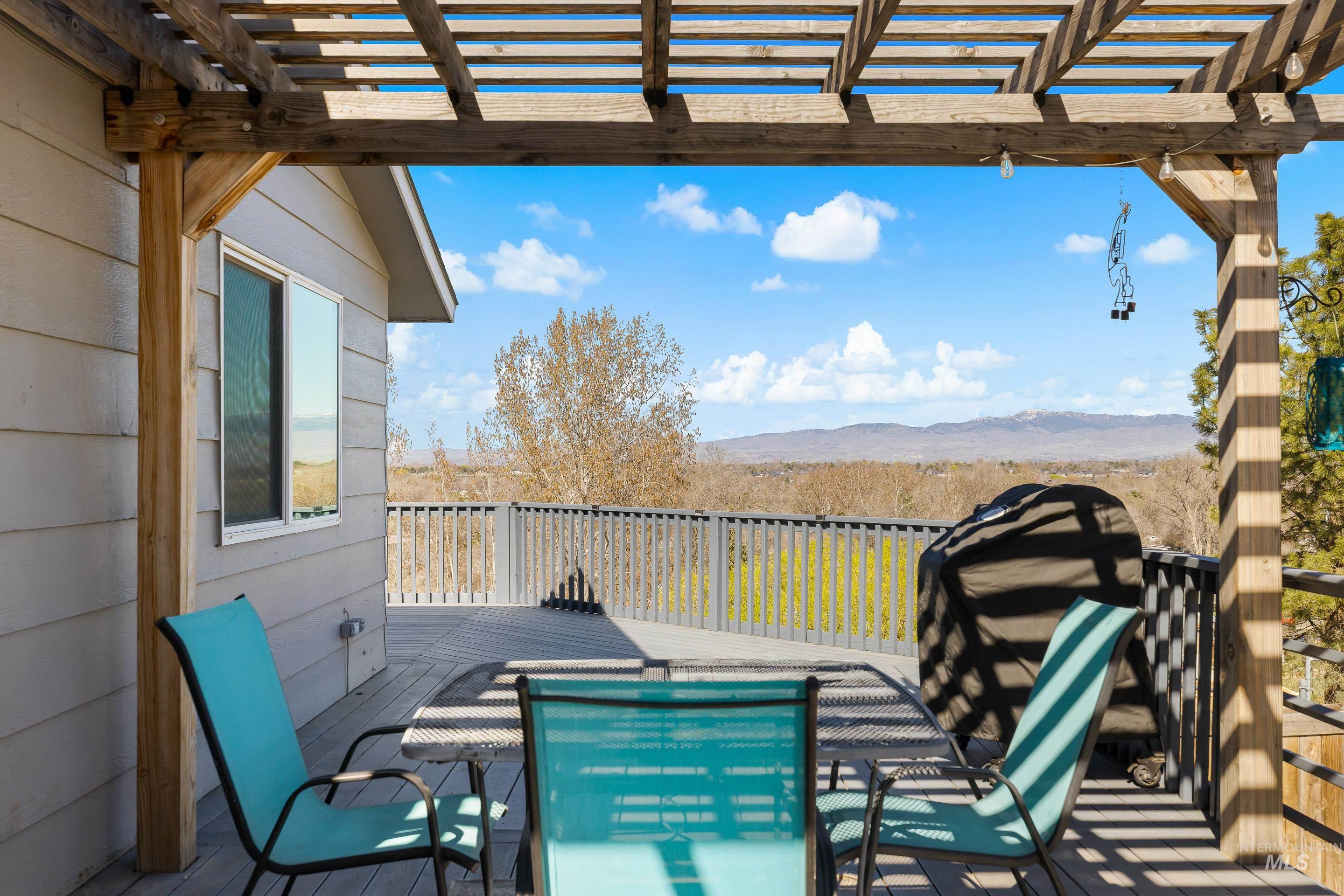 10294 West Fox Ridge Drive Boise, ID 83709 - Photo 47 of 50 View of patio with a deck with mountain view and a pergola