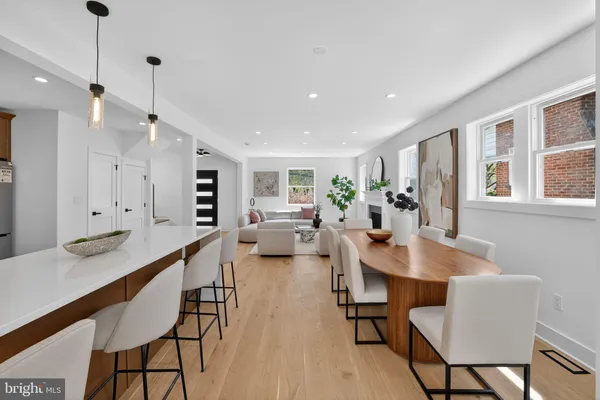 a living room with furniture and potted plant