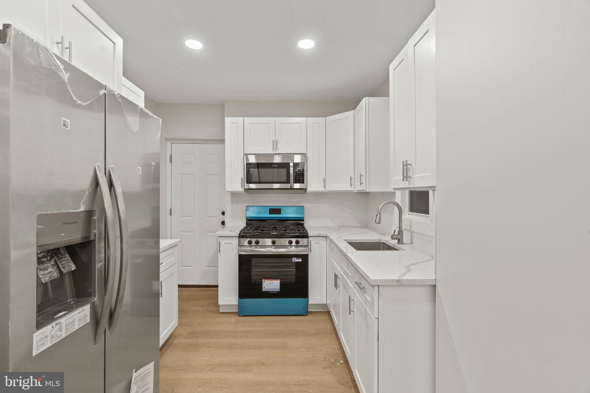 2321 West Firth Street Philadelphia, PA 19132 - Photo 14 of 21 Modern kitchen with sleek finishes.