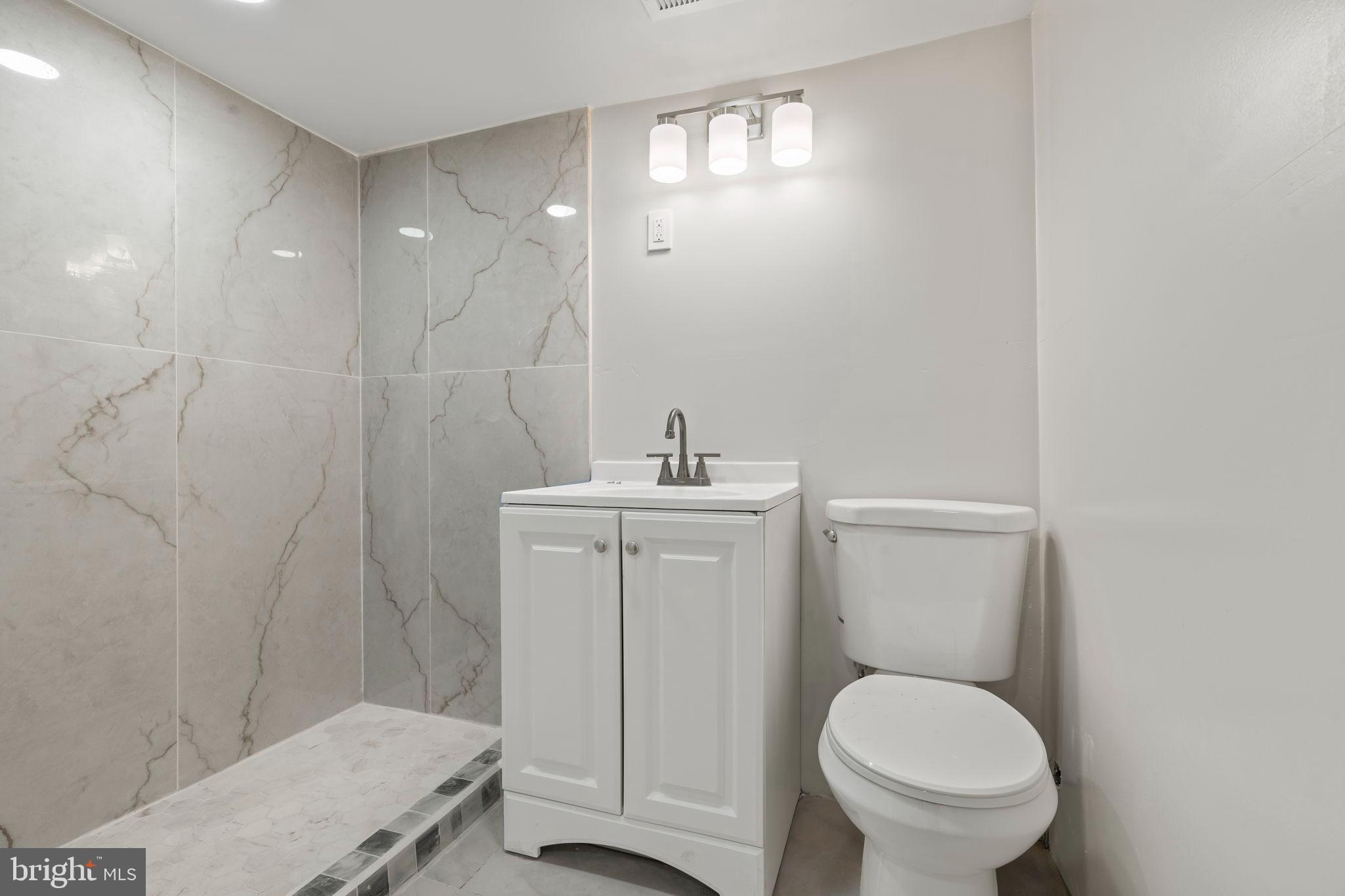 2321 West Firth Street Philadelphia, PA 19132 - Photo 18 of 21 Sleek modern bathroom with elegant finishes.