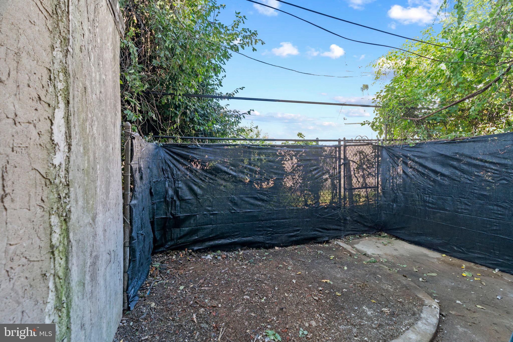 2321 West Firth Street Philadelphia, PA 19132 - Photo 21 of 21 Secluded outdoor space with lush greenery.