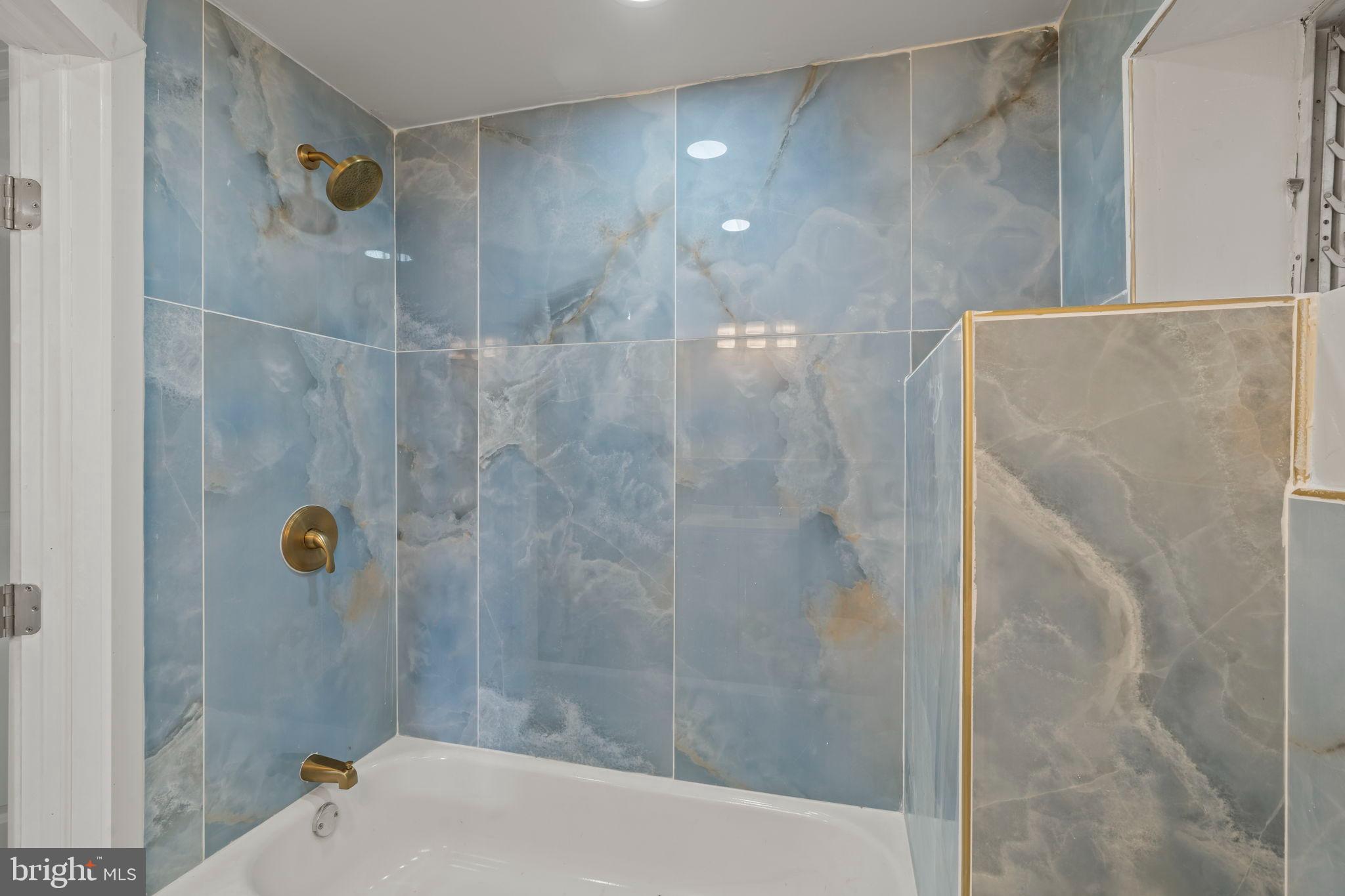 2321 West Firth Street Philadelphia, PA 19132 - Photo 8 of 21 Serene blue marble bathroom retreat.