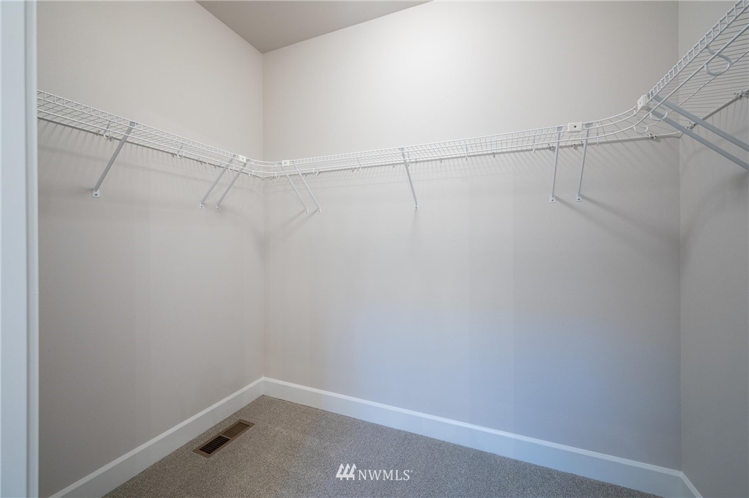 1411 Woods Point Loop Ferndale, WA 98248 - Photo 18 of 31 a view of a room with racks on the wall