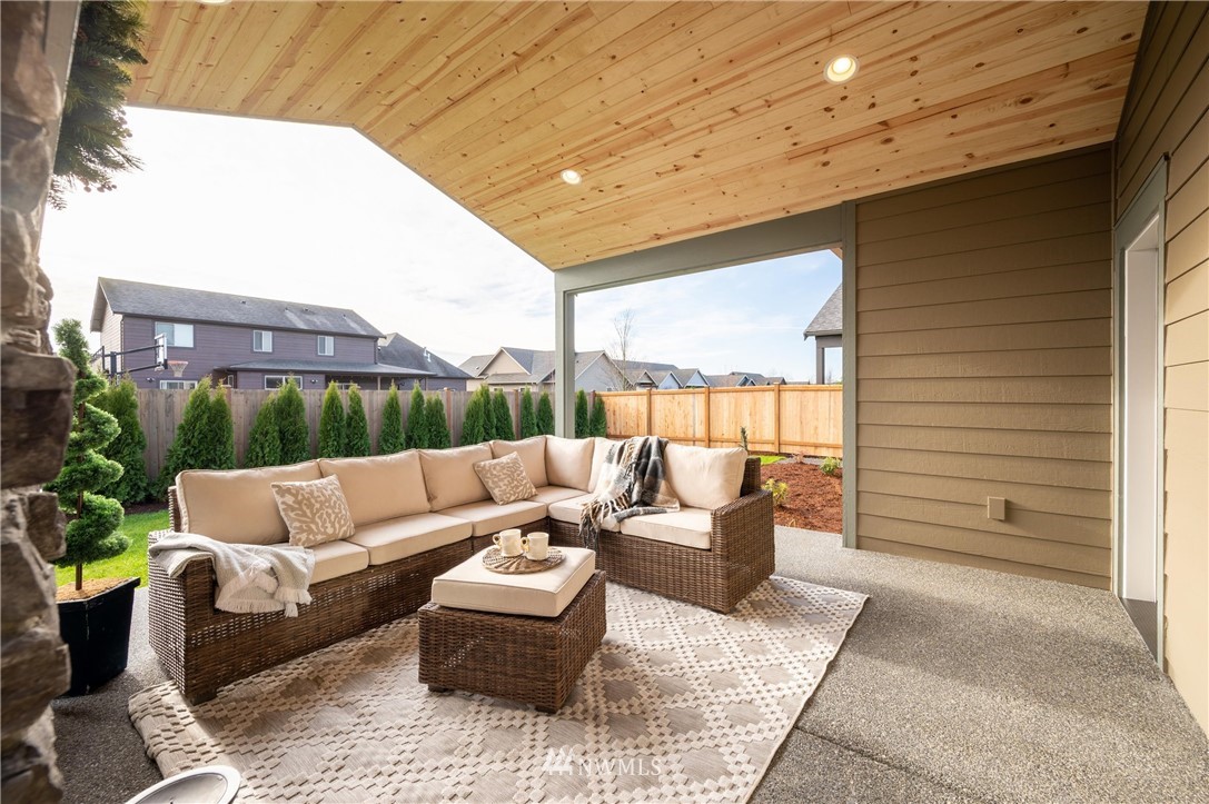 1411 Woods Point Loop Ferndale, WA 98248 - Photo 28 of 31 a outdoor living space with patio furniture and potted plants