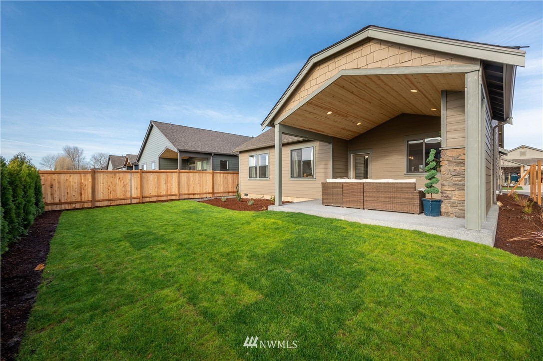 1411 Woods Point Loop Ferndale, WA 98248 - Photo 29 of 31 a view of an house with backyard and porch