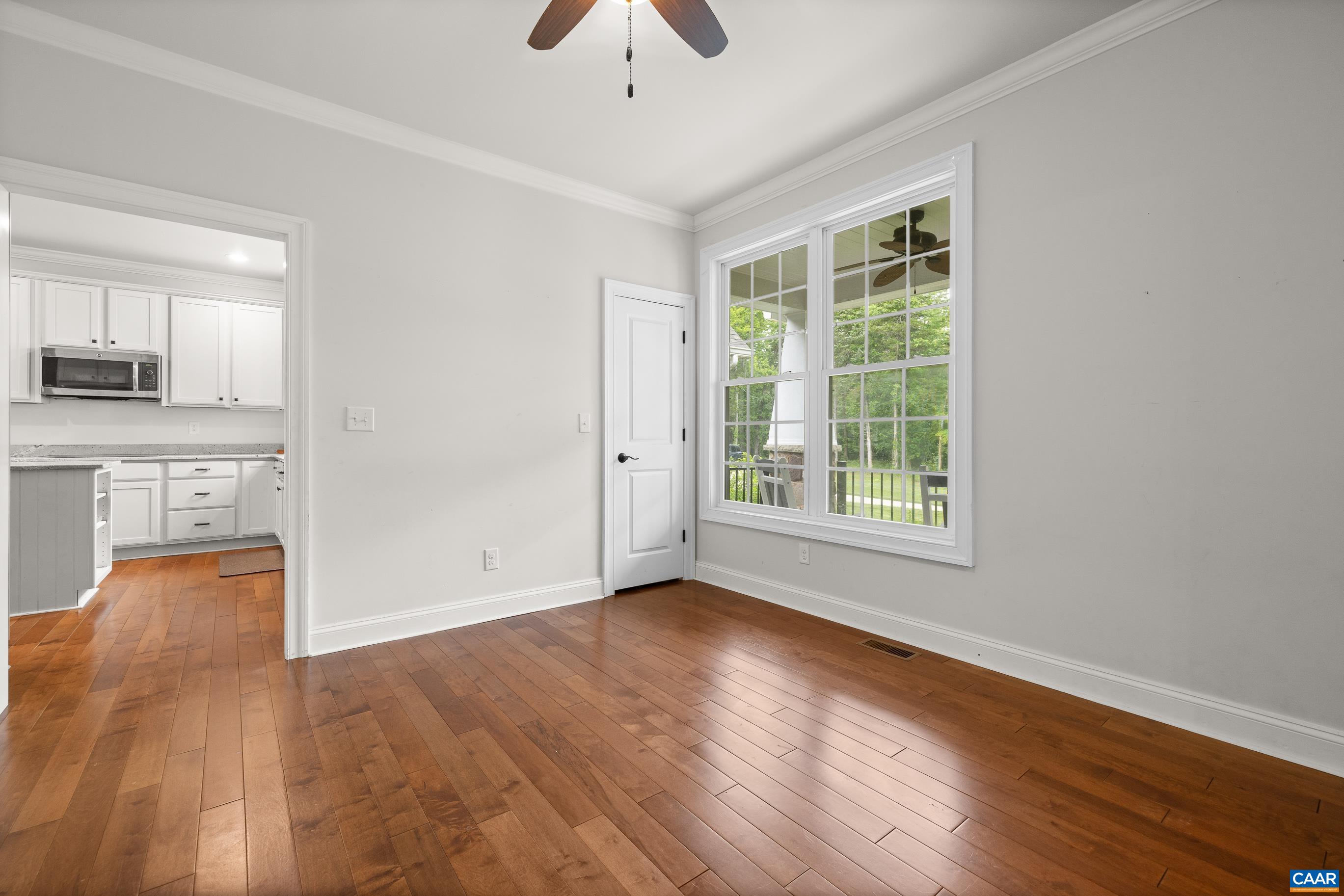 7325 3 Notch Road Louisa, VA 23093 - Photo 15 of 65 a view of an empty room with wooden floor and a window
