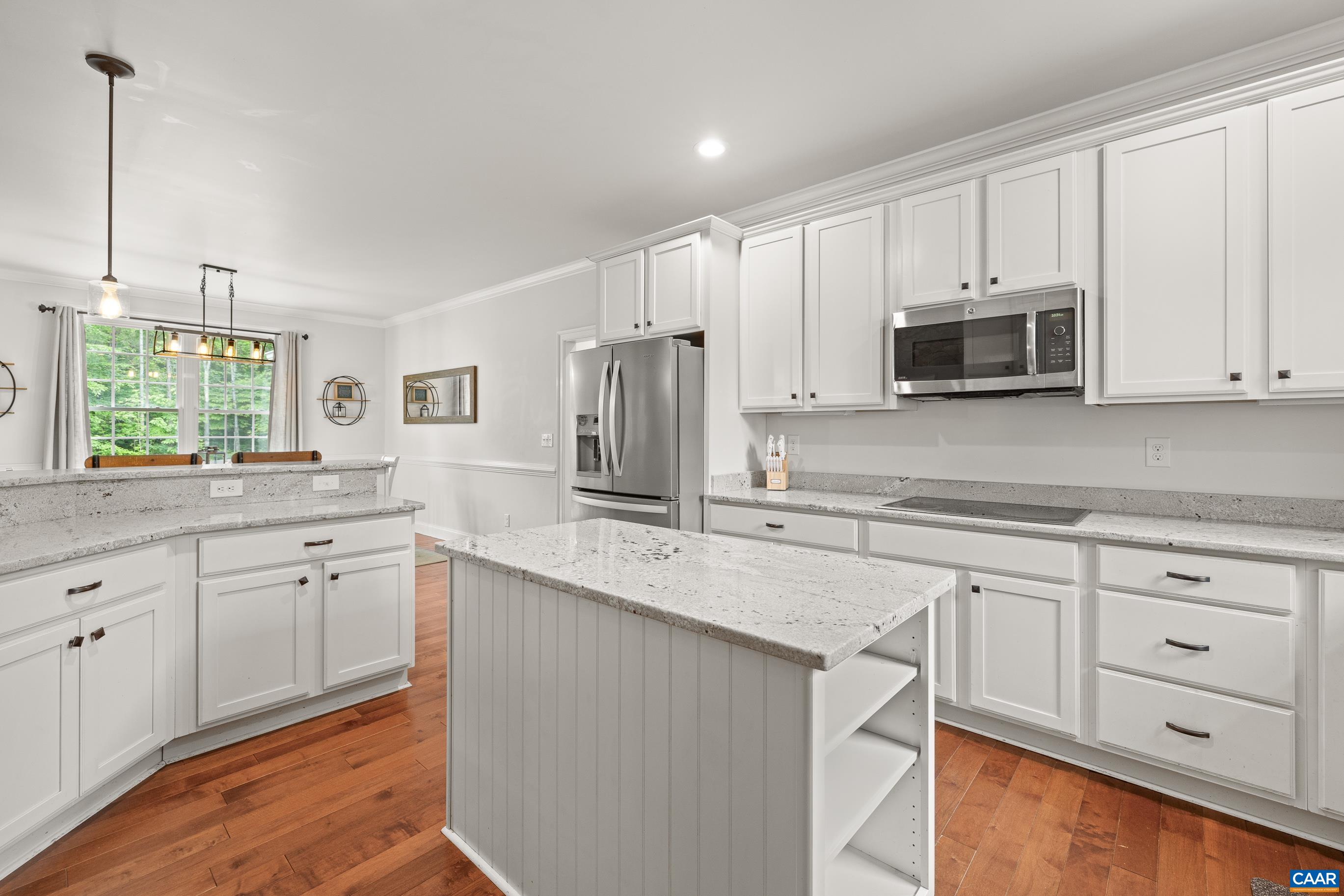 7325 3 Notch Road Louisa, VA 23093 - Photo 21 of 65 a kitchen with stainless steel appliances granite countertop a stove a sink and a microwave