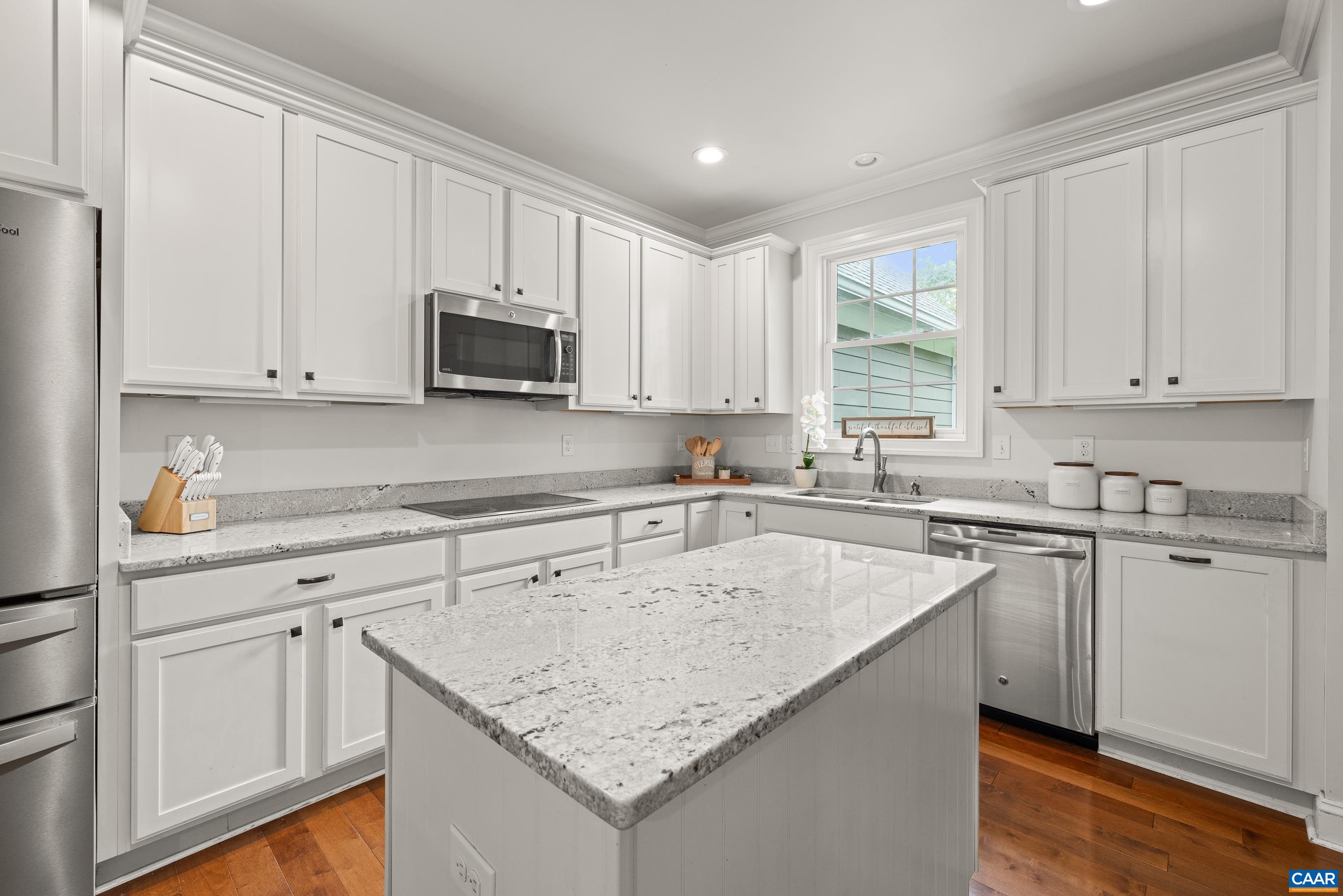 7325 3 Notch Road Louisa, VA 23093 - Photo 22 of 65 a kitchen with granite countertop white cabinets and a sink