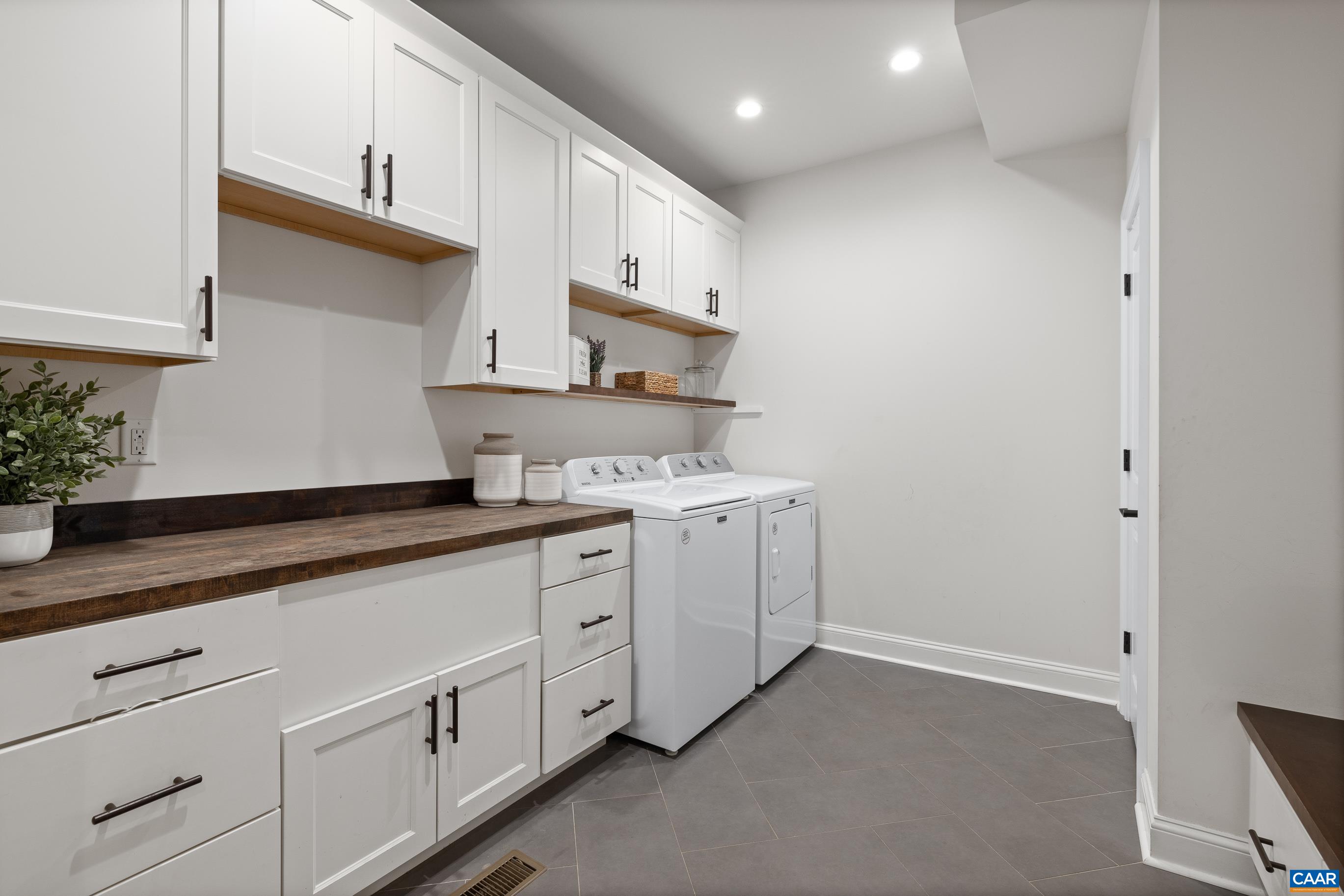 7325 3 Notch Road Louisa, VA 23093 - Photo 26 of 65 a kitchen with white cabinets and white appliances