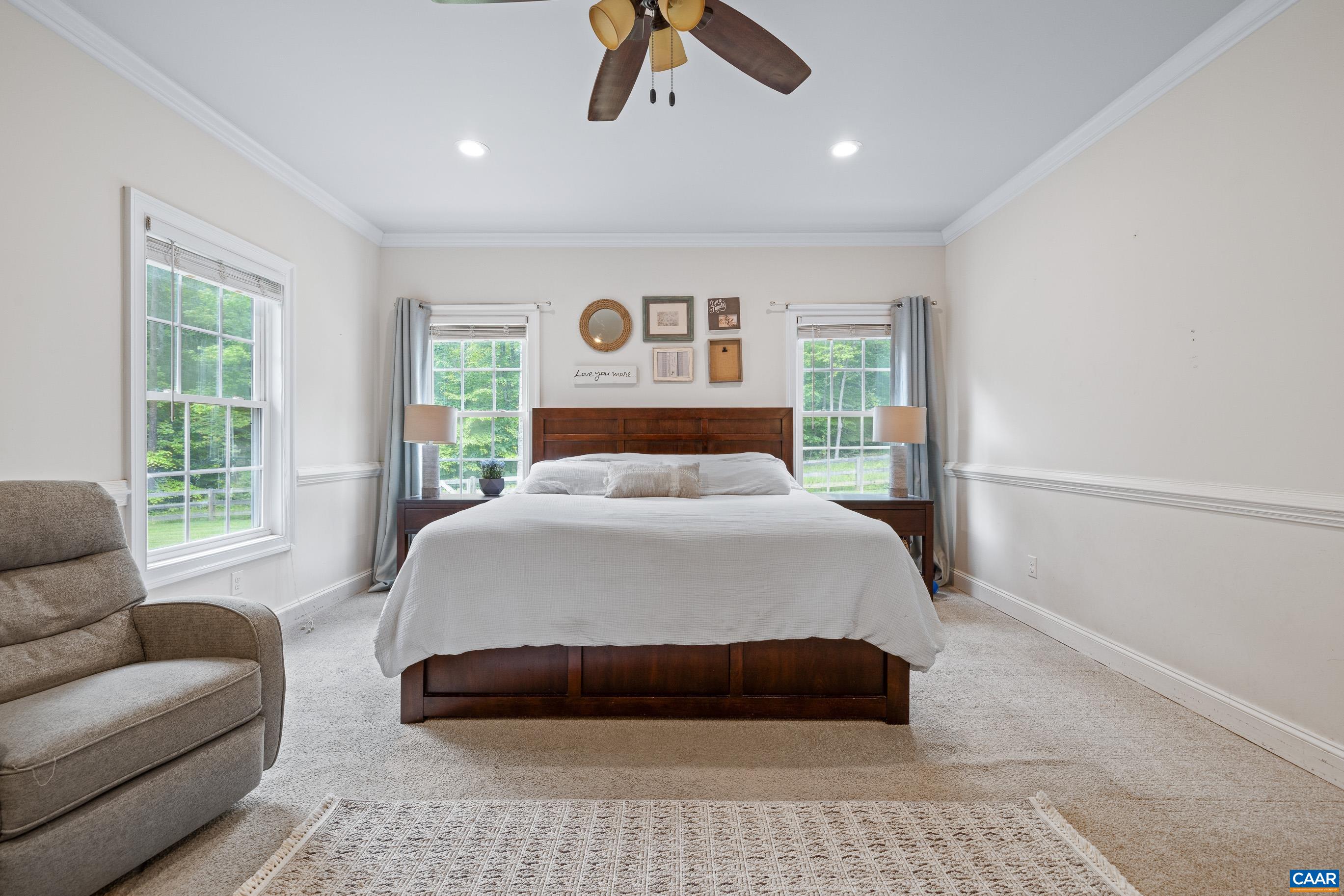 7325 3 Notch Road Louisa, VA 23093 - Photo 29 of 65 a bedroom with a large bed couch and a window