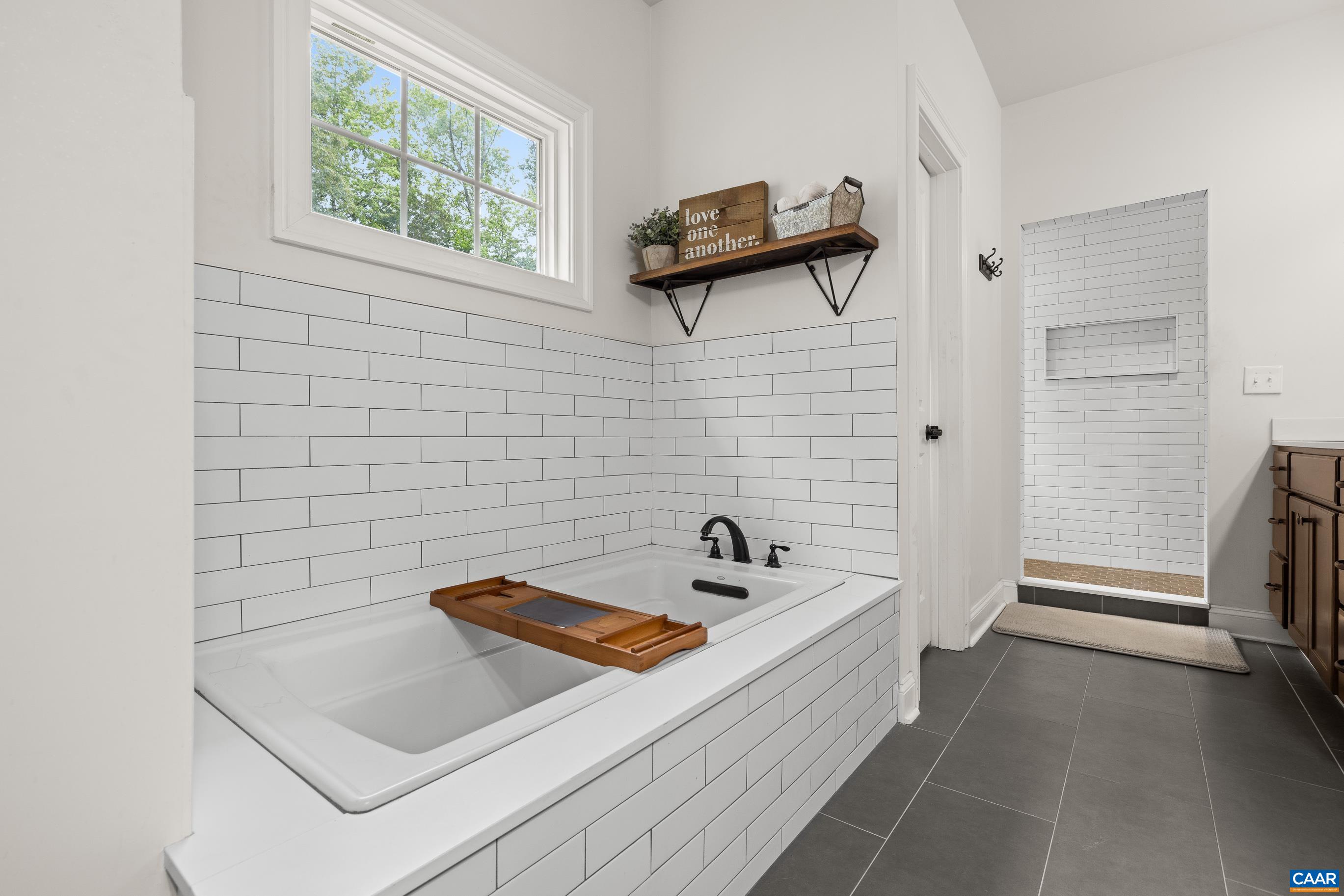 7325 3 Notch Road Louisa, VA 23093 - Photo 32 of 65 a bathroom with a bathtub and a shower