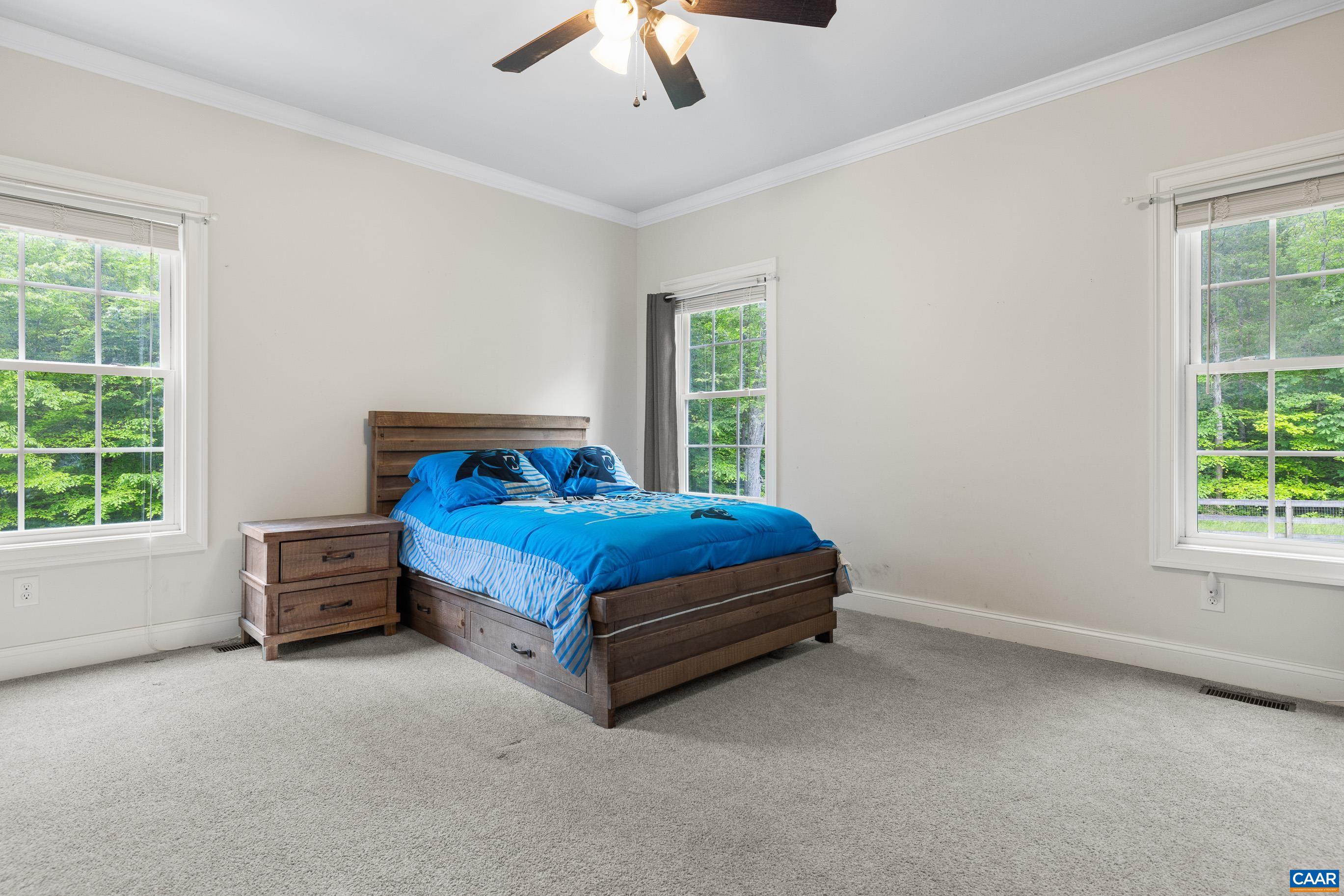 7325 3 Notch Road Louisa, VA 23093 - Photo 40 of 65 a bedroom with a bed and a window