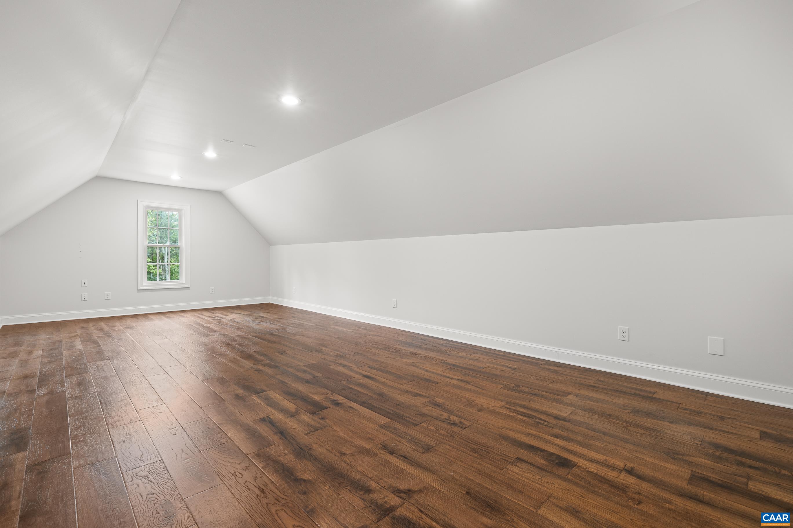 7325 3 Notch Road Louisa, VA 23093 - Photo 45 of 65 an empty room with wooden floor and windows